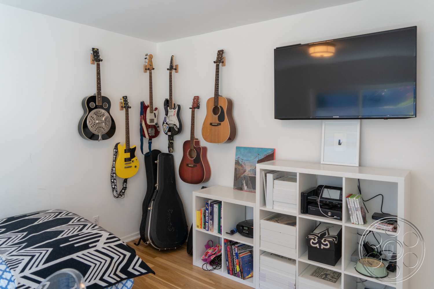 Americana 338 - indoors, furniture, monitor, display, entertainment center, leisure activities, musical instrument, lcd screen, television, tv, bookcase, guitar