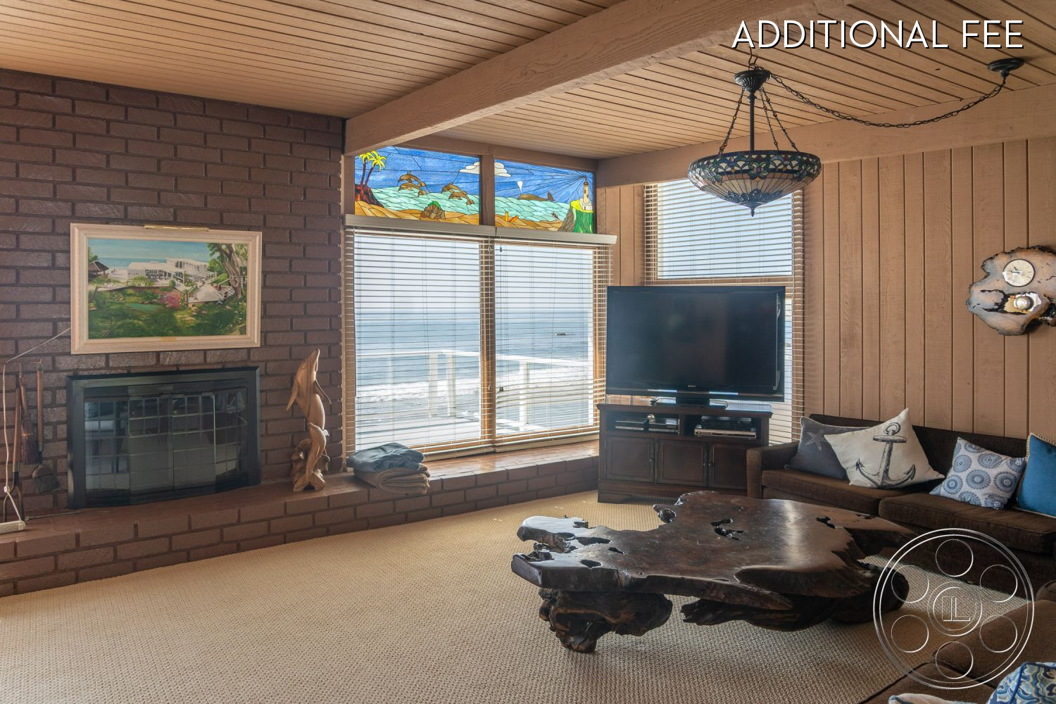 Dolphin Beach House - indoors, wood, furniture, room, living room, couch, hardwood, monitor, display, entertainment center, lcd screen, television, tv