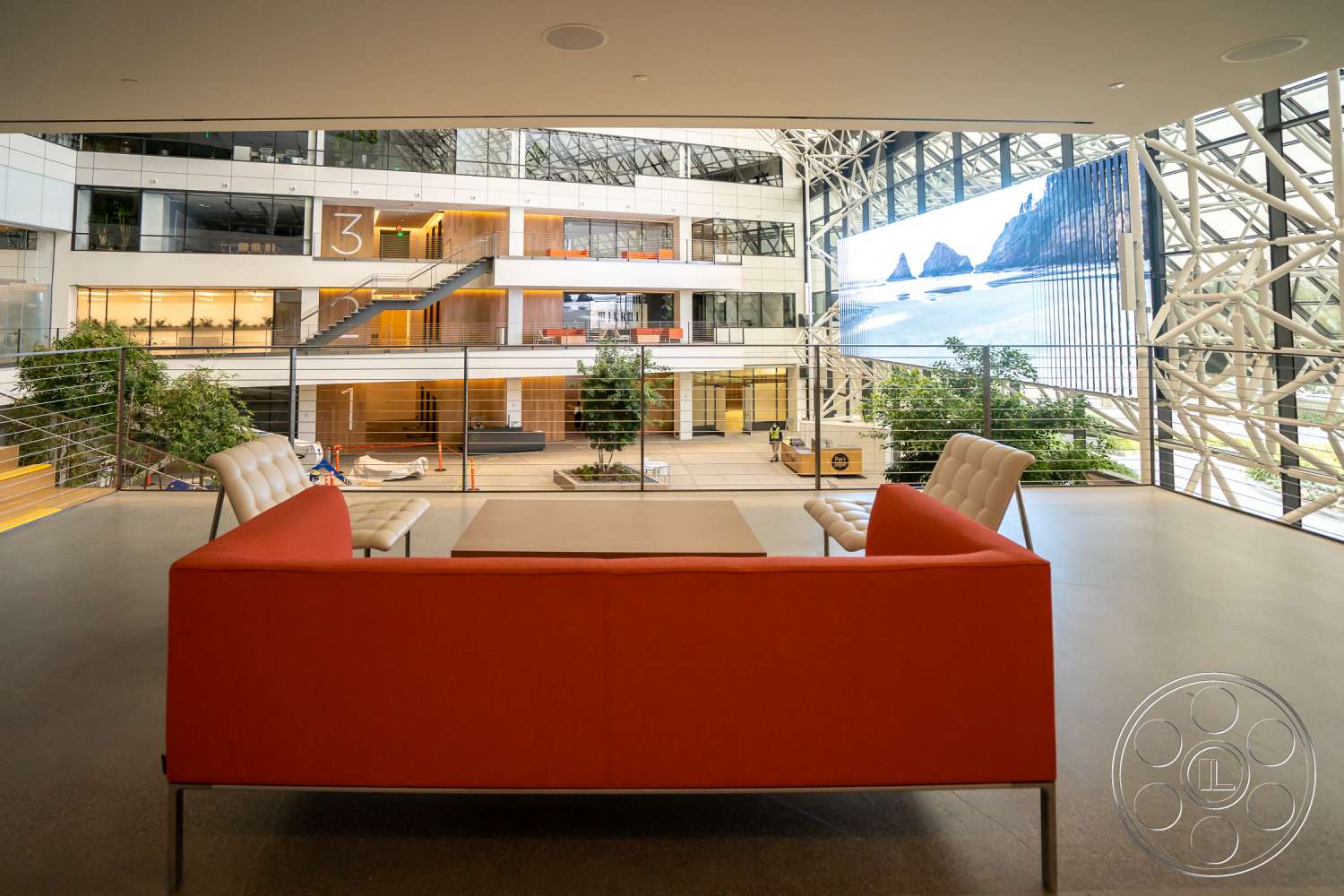 The Atrium - indoors, wood, furniture, table, room, lobby, living room, couch, coffee table, reception, tabletop