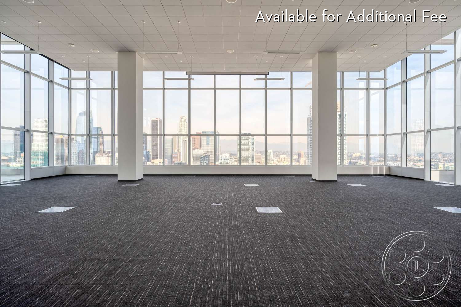 SKYstudio® - open floor plan, high ceilings, natural light, minimalist decor, contemporary design, modern architecture, creative workspace, flexible layout, versatile setting, urban environment, commercial space, floor-to-ceiling windows, neutral wall color, meeting space, city skyline view, grey carpet flooring, bright ambient lighting, large empty area