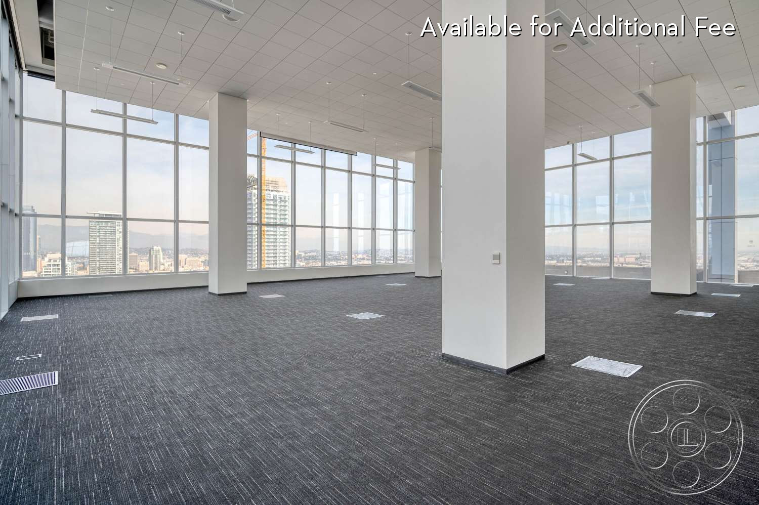 SKYstudio® - large windows, high ceiling, exposed beams, open floor plan, minimalist decor, neutral color palette, clean lines, ambient lighting, flexible layout, modern office, commercial space, professional setting, grey carpet, city skyline view, concrete columns, sparse furniture, bright atmosphere, high-rise building