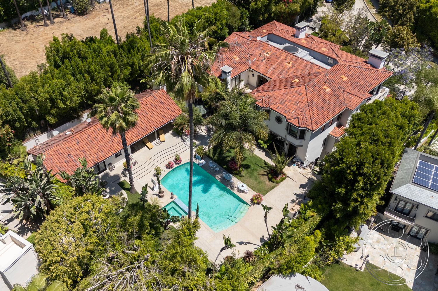 Medit 165 - natural light, exterior, white stucco walls, palm trees, outdoor seating area, relaxed atmosphere, patio, swimming pool, private retreat, architectural details, garden, lush landscaping, poolside, spa area, elegant, plant beds, resort-style, tropical, Mediterranean architecture, red tile roof, scenic views, vacation home, hot tub, luxurious villa, natural stone pavement, dining terrace