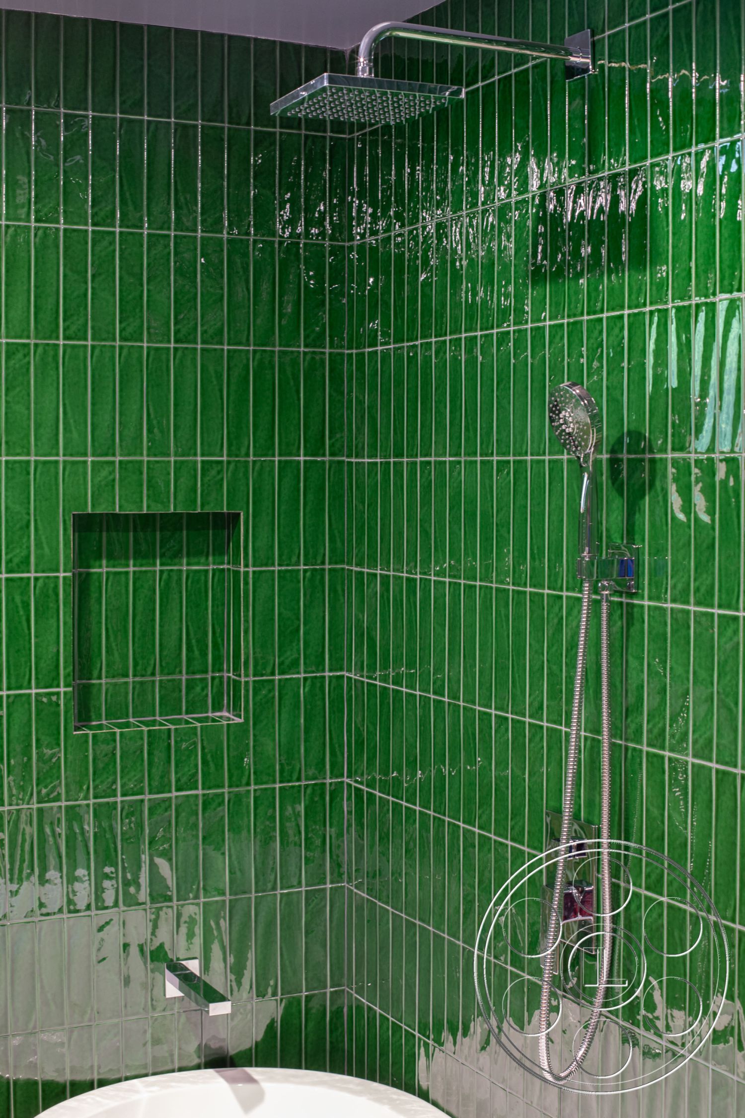 Bungalow 56 - freestanding bathtub, minimalist design elements, chrome plumbing fixtures, shower with rain showerhead, glossy green tile shower walls, built-in niche for shower items, modern bathroom interior, textured grout lines, contemporary bathroom decor, luxury shower design