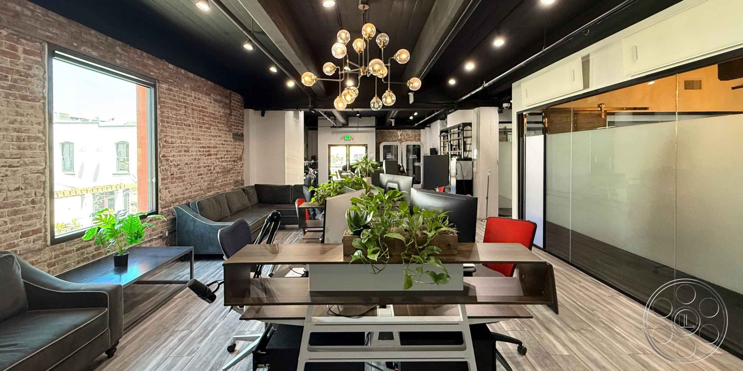 Office 124 - glass partition walls interior, exposed brick accent wall interior, open concept layout interior, dark wood beam ceiling interior, large windows with city view interior, potted plants decor interior, hardwood flooring office space, modern pendant lighting fixtures interior, contemporary office furniture interior, plush seating area interior