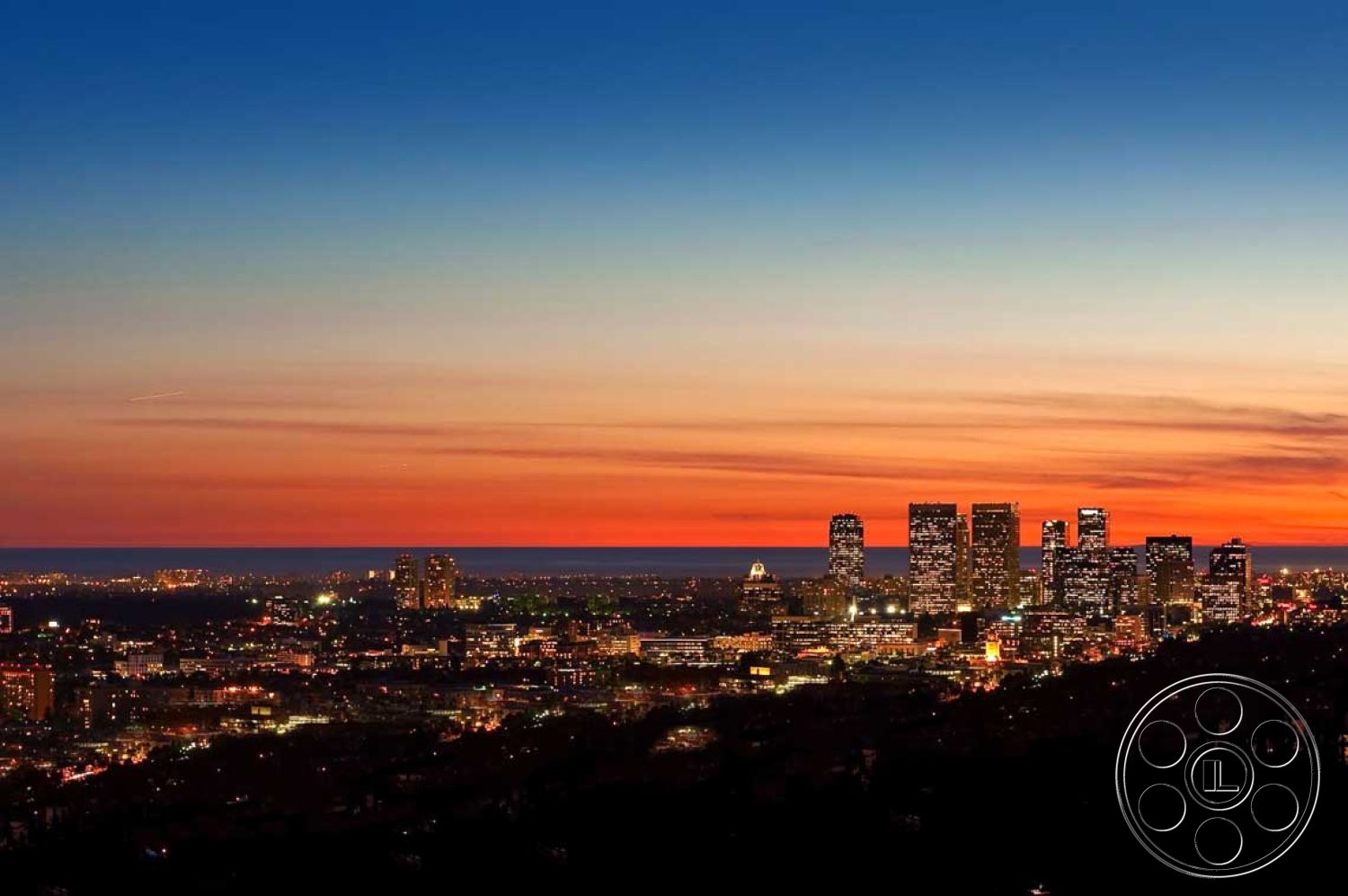 Modern 507 - urban environment, urban rooftop, city skyline view, high-rise buildings, vibrant color palette, hillside location, exterior evening skyline, modern architectural styles, contemporary cityscape, evening sunset glow, varied building heights, illuminated city lights, horizon line with sunset colors, panoramic cityscape, metropolitan skyline