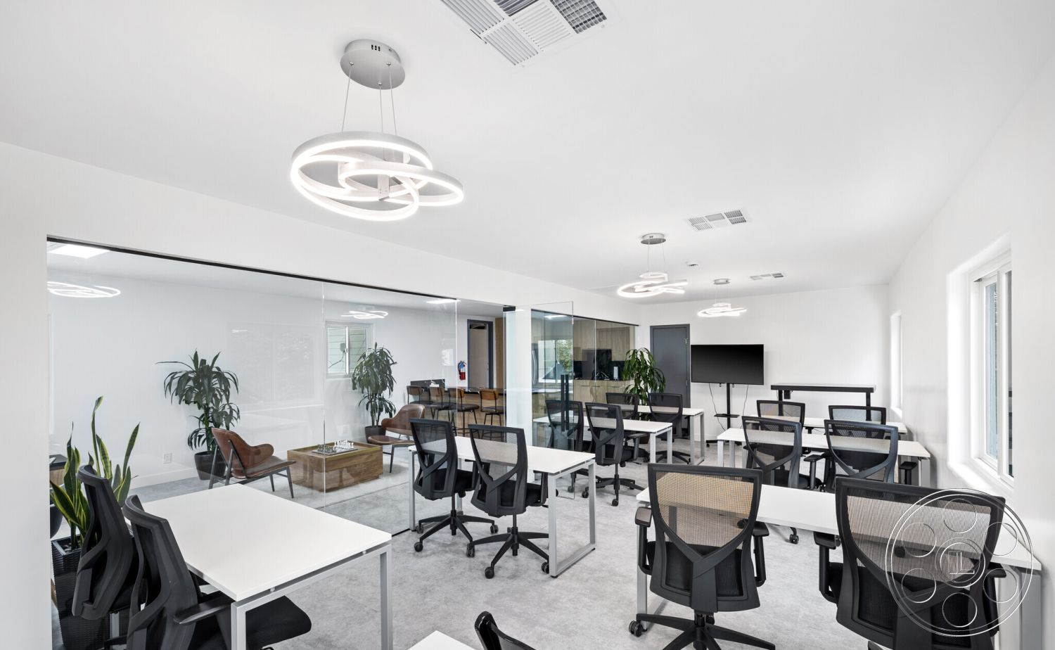 Office 125 - office, white painted walls interior, exposed concrete walls interior, glass partition walls interior, floor-to-ceiling windows interior, open office layout interior, modern office furniture interior, concrete flooring interior, rectangle conference tables interior, mesh office chairs interior, LED pendant lighting interior, indoor plants for decor interior, minimalistic design interior, natural light workspace interior, modern lighting fixtures interior, cozy lounge area interior