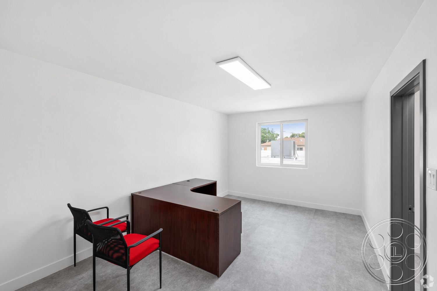 Office 125 - contemporary furniture, minimalist design elements, white painted walls, black leather office chair, interior office space, carpet bedroom flooring, flat-panel ceiling lights, dark wood office desk, single window for natural light