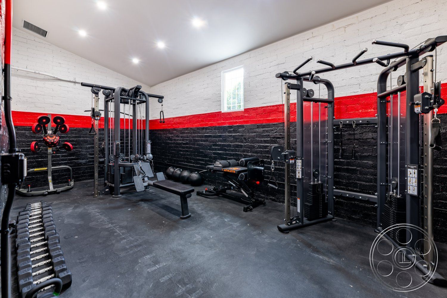 Office 125 - gym, floor-to-ceiling windows, exposed brick walls, modern fitness equipment, white painted ceiling, industrial style lighting, black painted wall accents, rubber gym flooring, interior gym space, multifunctional workout area, red and black color scheme, open layout fitness room