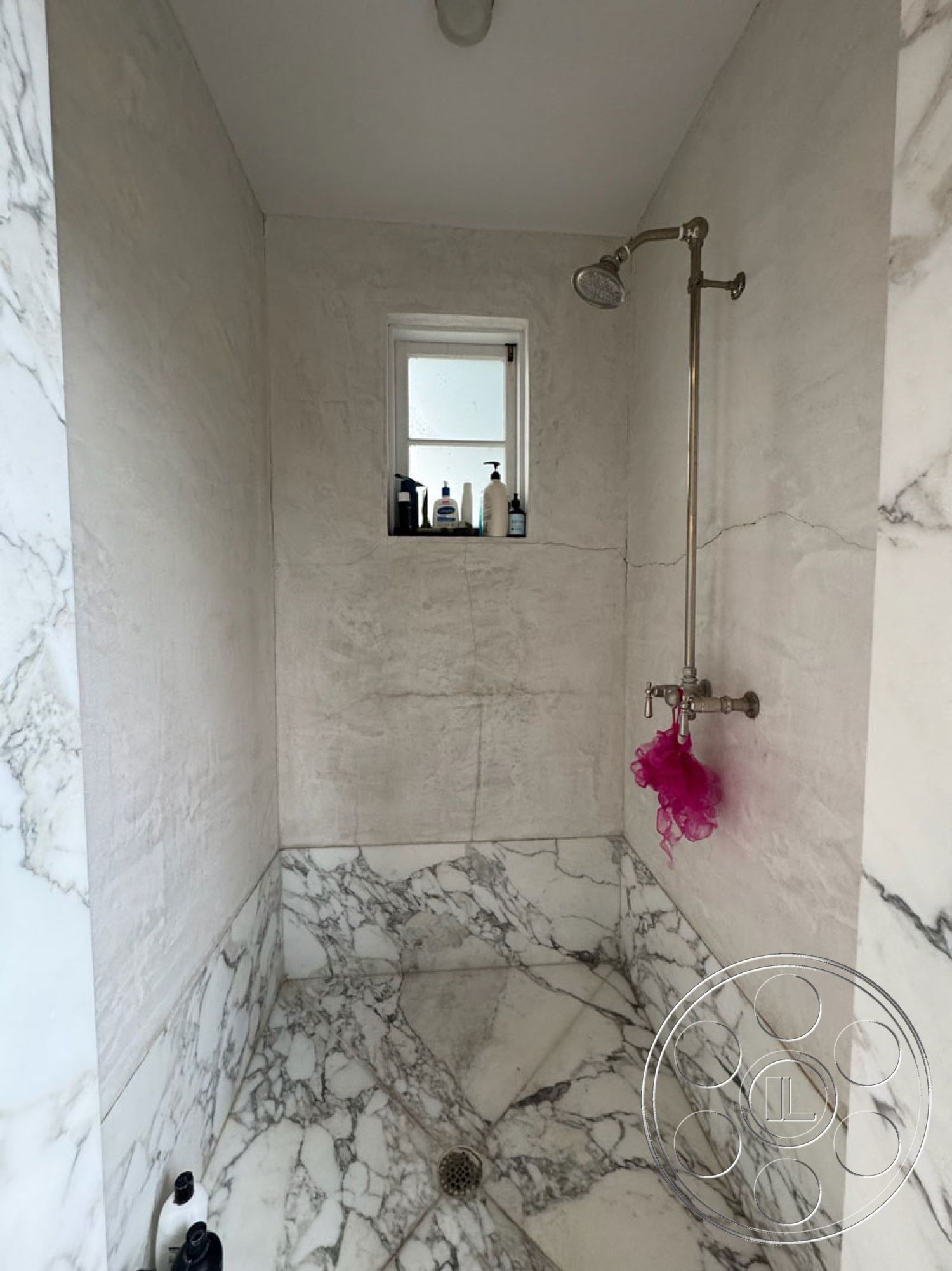 Spanish 165 - natural light from window, minimalist bathroom design, chrome shower fixtures, interior bathroom space, textured plaster wall treatment, marble shower walls, marble shower flooring, rectangular shower design
