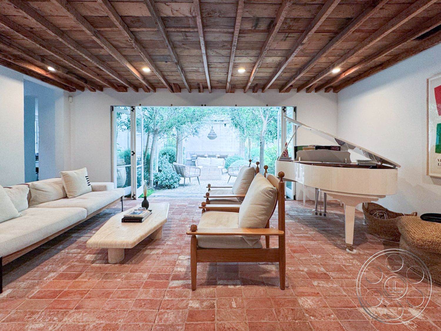 Spanish 165 - glass sliding doors interior, exposed wood ceiling beams interior, white painted walls interior, natural light-filled space interior, open concept living area interior, indoor plants for decor interior, minimalist coffee table interior, terracotta tile flooring interior, modern sofa with soft upholstery interior, piano in living area interior, wooden furniture accents interior, outdoor views from living area interior, scandinavian design elements interior, textured wall surfaces interior, relaxed seating arrangement interior