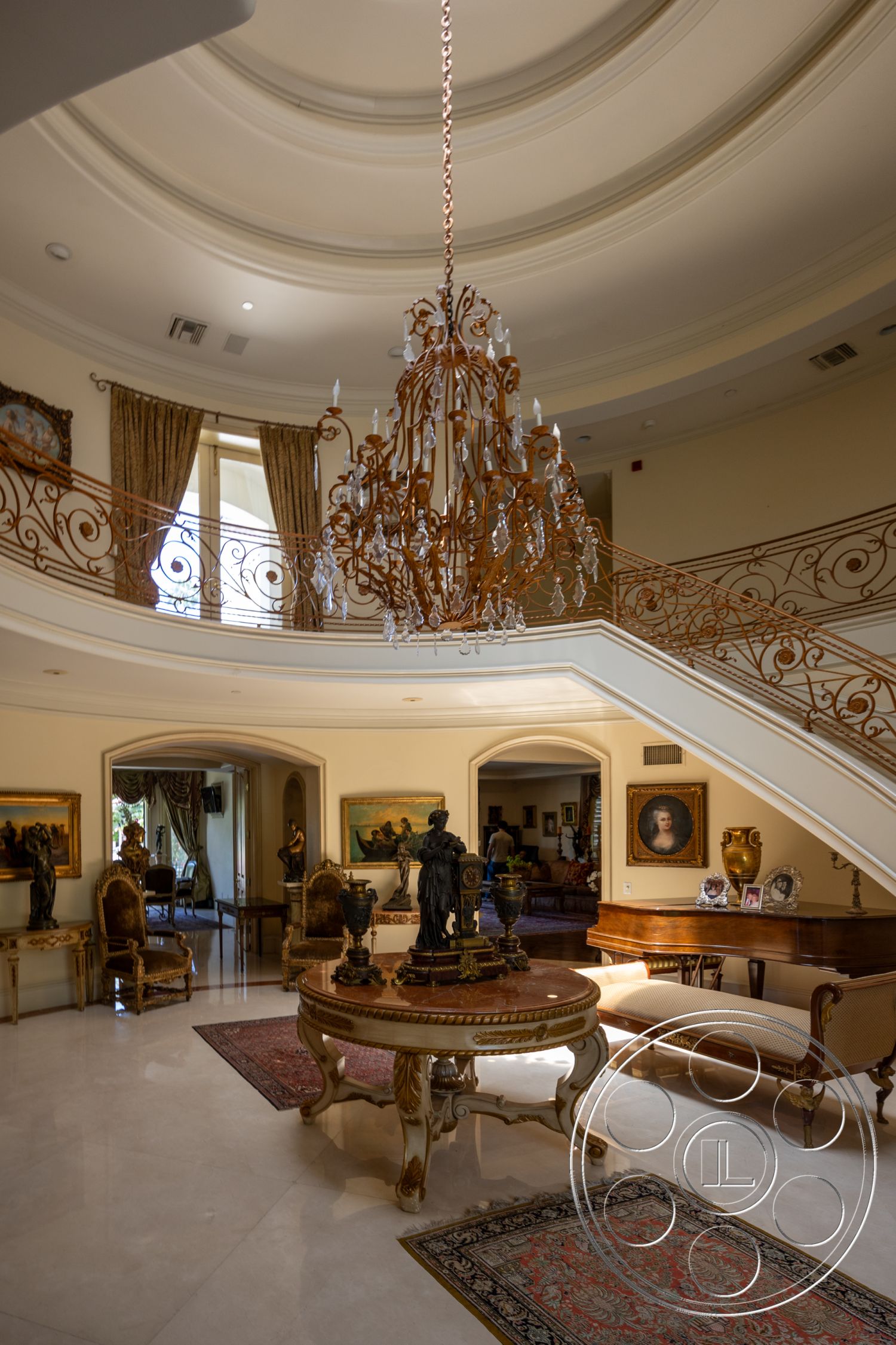 Medit 165 - interior open-concept layout, interior decorative crown molding, exterior arched doorways, interior coffered ceiling, interior marble flooring, interior designer furnishings, exterior chandelier lighting, curved staircase with wrought iron railing, interior large windows with drapery, antique wooden furniture, exterior balcony view, interior gallery wall with framed art, intricate wrought iron banister, interior plush area rugs, exterior ornate ceiling, interior sculptural décor elements, light-colored walls with artistic accents, interior elegant seating arrangements, exterior natural lighting, interior multi-level design