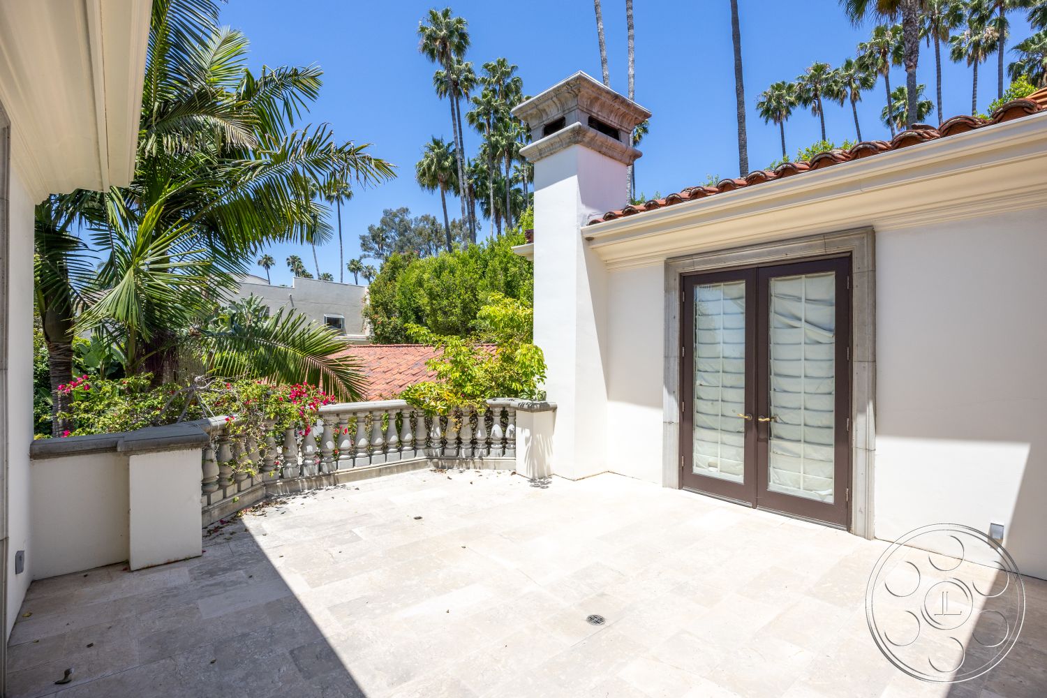 Medit 165 - landscaped garden view, outdoor living space, natural stone flooring, double French doors, Mediterranean architectural style, ornamental balustrade, sunny outdoor setting, stucco wall treatment, exterior courtyard area, palms and foliage surroundings, masonry planter, tiled roof elements, solid wood door frames