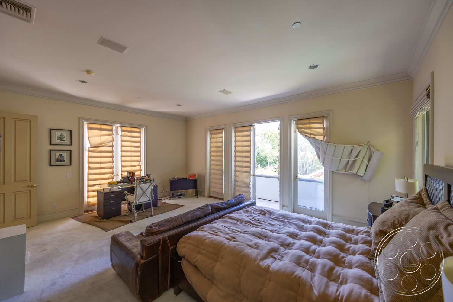 Medit 165 - light-colored walls, suburban setting, floor-to-ceiling windows, leather sectional sofa, dark wood door frame, carpet bedroom flooring, beige painted walls, folding window shades, exposed ceiling with recessed lighting, home office space, queen-size upholstered bed, office desk with metal legs
