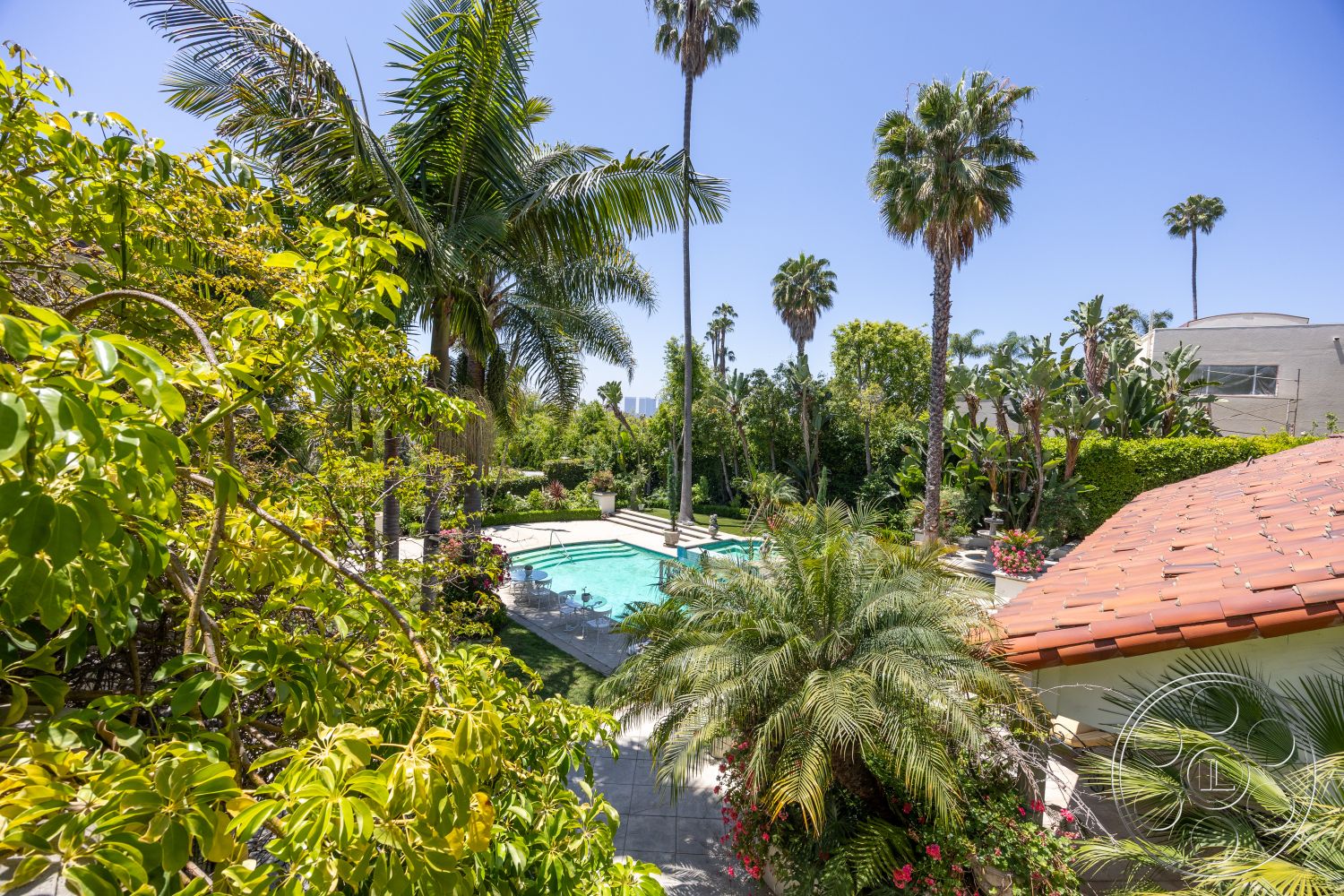 Medit 165 - outdoor dining area, modern outdoor lighting, garden pathway, terracotta tiles, rectangular pool, poolside lounge area, exterior concrete pool border, landscaped garden setting, stone patio flooring, lush tropical plants, iron patio furniture, private backyard oasis, tiled roof house, palm tree surroundings, textured concrete decking, colorful floral arrangements, sunny tropical environment, suburban residential area, contemporary house design