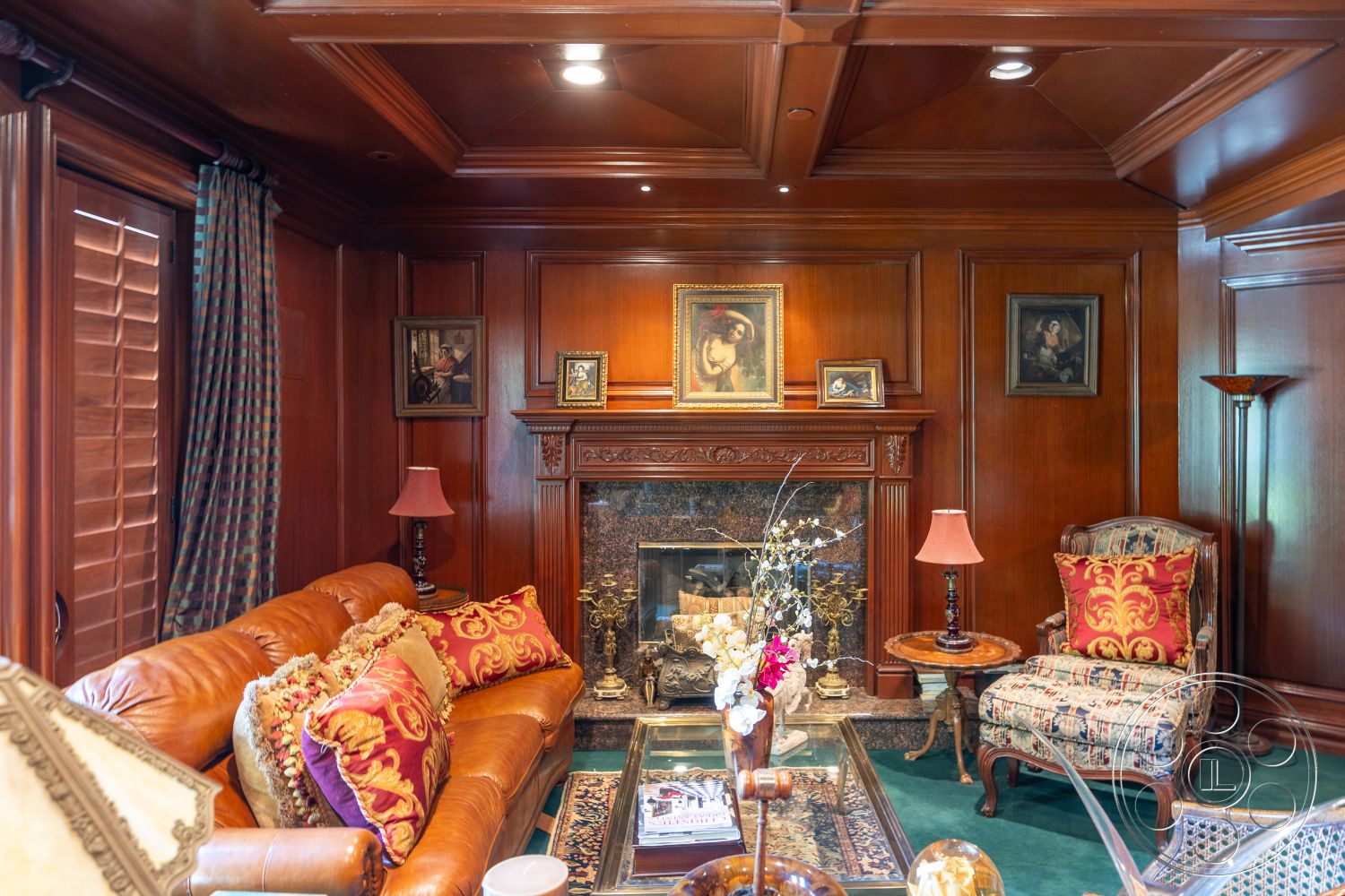 Medit 165 - interior, polished hardwood paneling, coffered ceiling details, decorative crown molding, ornate fireplace mantel, granite fireplace surround, plush leather sofa, traditional accent pillows, antique-style table lamp, hardwood living room floors, rich burgundy drapery, framed art wall decor, plush area rug, vintage armchair, detailed woodwork, elegant interior lighting, warm color palette, classic decorative accessories