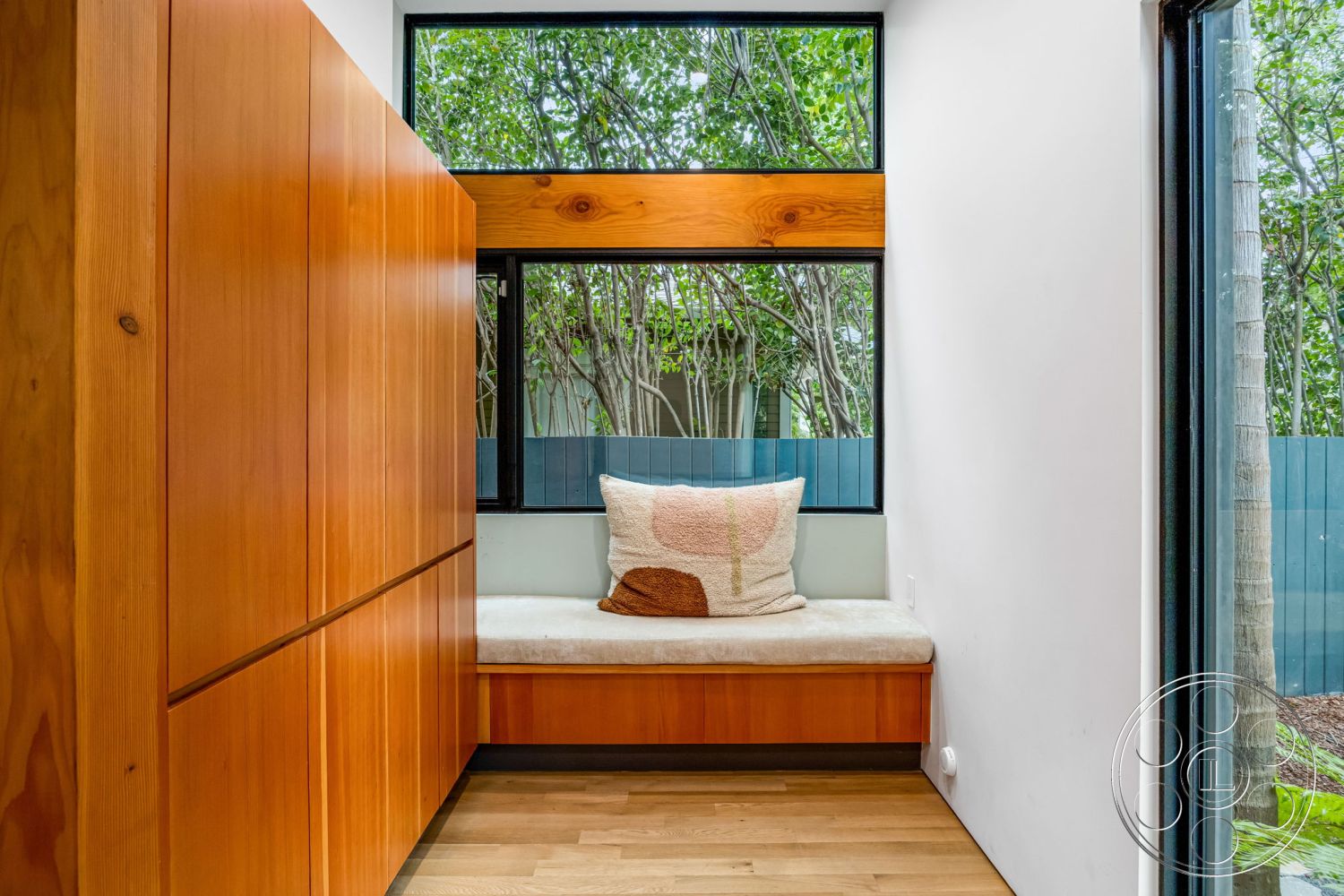 Modern 508 - interior neutral color palette, interior natural light, interior hardwood flooring, interior cozy seating area, interior minimalist design, interior large glass windows, interior wood wall paneling, interior built-in window seat, interior modern decor, exterior garden view