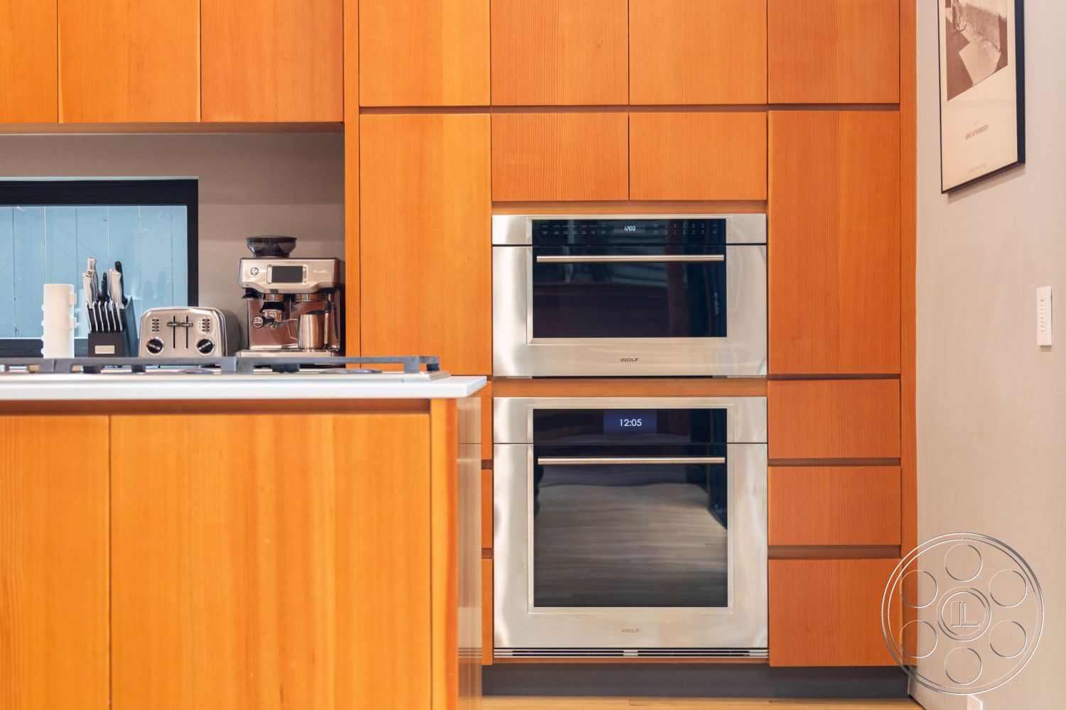 Modern 508 - modern kitchen design, integrated kitchen appliances, minimalist kitchen layout, stainless steel appliance finishes, interior kitchen with wood cabinetry, maple wood kitchen cabinets, stainless steel wall ovens, black countertop with gas cooktop, light blue tile backsplash, open shelving for kitchen essentials, floor-to-ceiling cabinetry, contemporary kitchen handles, textured wall treatment behind the kitchen, warm wood tones in kitchen cabinetry, efficient kitchen storage solutions