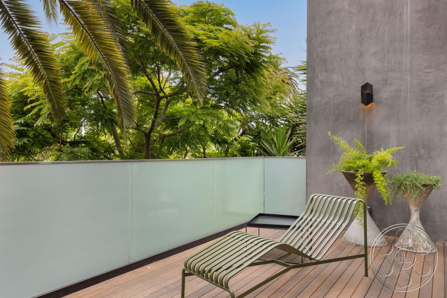 Modern 508 - exterior, metal patio furniture, modern lounge chair, contemporary outdoor living space, concrete wall finish, wood deck flooring, glass balcony railing, natural light ambiance, landscaped tropical setting, decorative planter with ferns, minimalist outdoor lighting, palm tree foliage