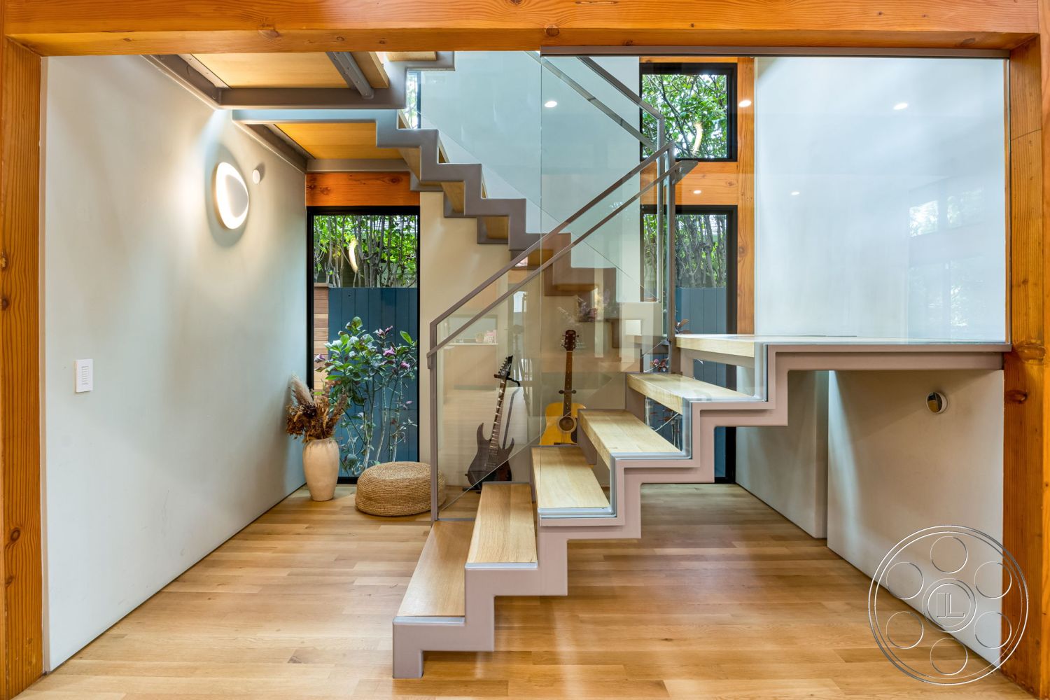 Modern 508 - exposed wood ceiling beams interior, white painted walls interior, natural light from large windows interior, open concept layout interior, contemporary design elements interior, glass partition wall interior, minimalist decor interior, floating staircase with steel railings interior, hardwood entryway flooring interior, eco-friendly materials interior, indoor plants for natural aesthetics interior, modern pendant lighting fixture interior, functional home office nook interior