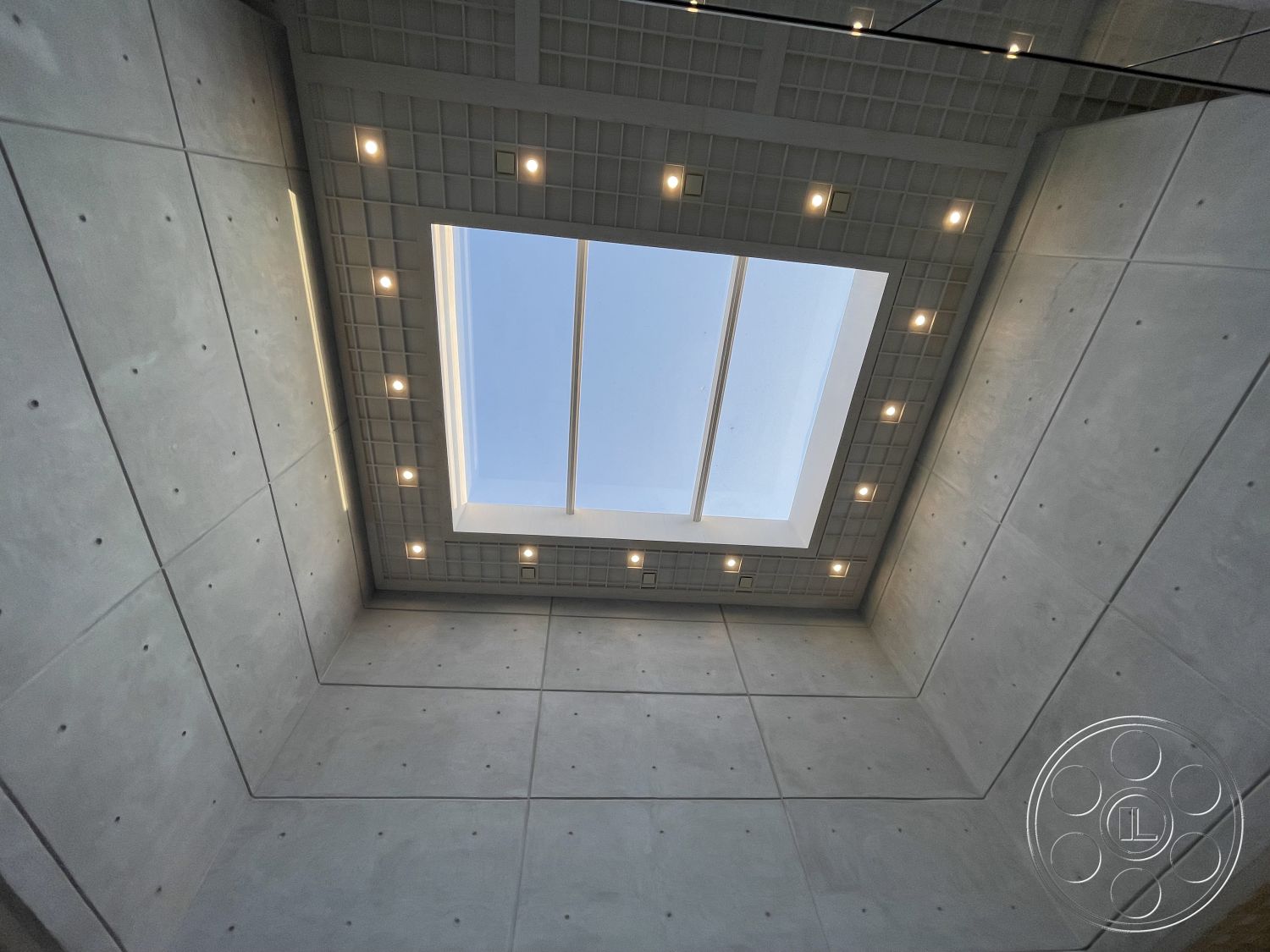 Modern 509 - exposed concrete ceiling, geometric ceiling design, smooth concrete finish, flat roof design, minimalist architectural style, recessed LED lighting, interior concrete walls, skylight feature
