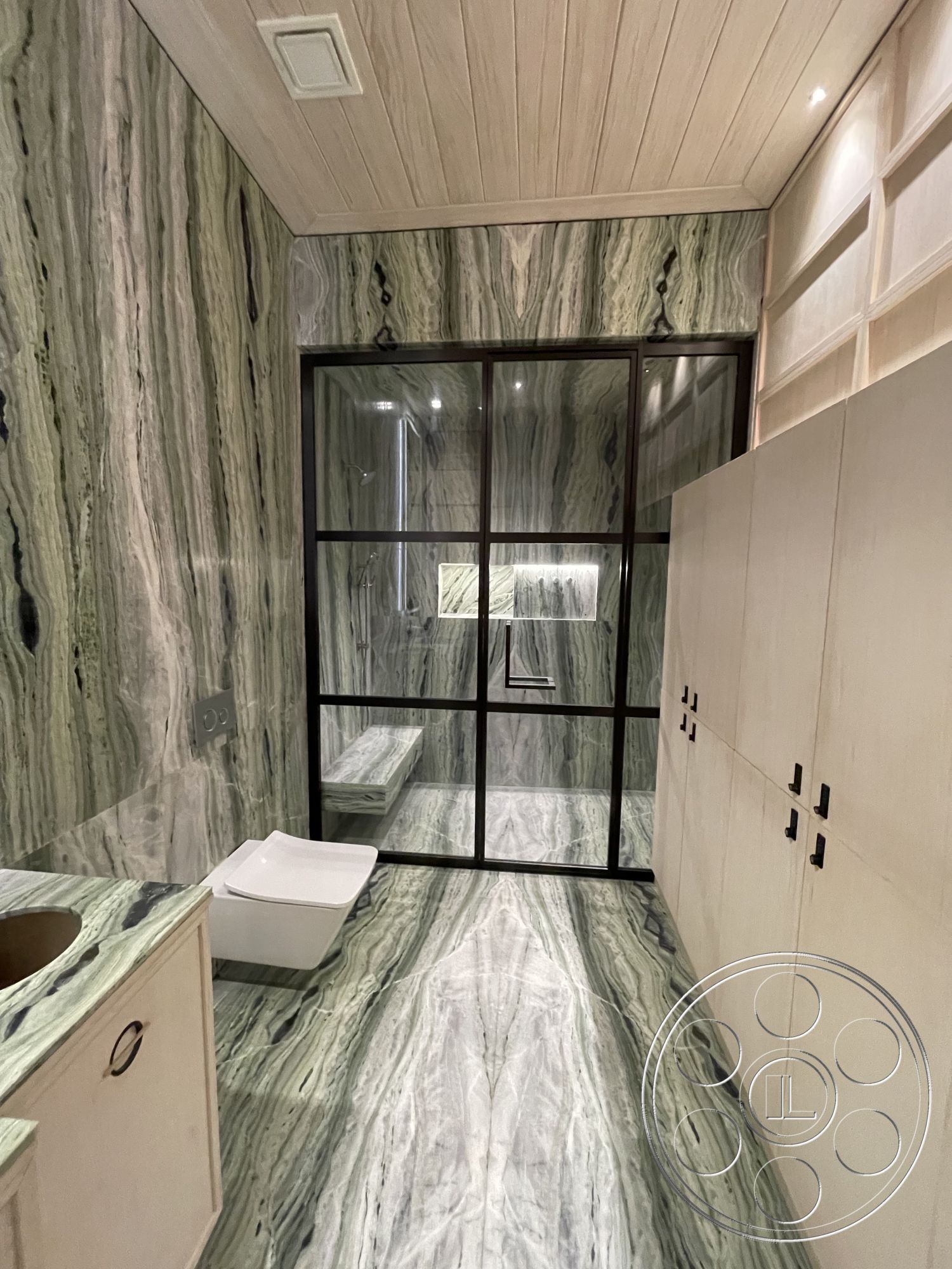 Modern 509 - interior built-in cabinetry, interior recessed lighting fixtures, interior marble bathroom walls, interior marble bathroom flooring, interior wood panel ceiling, interior black-framed glass shower enclosure, interior modern floating vanity, interior minimalist toilet, interior matte black cabinet hardware, interior contemporary sink basin