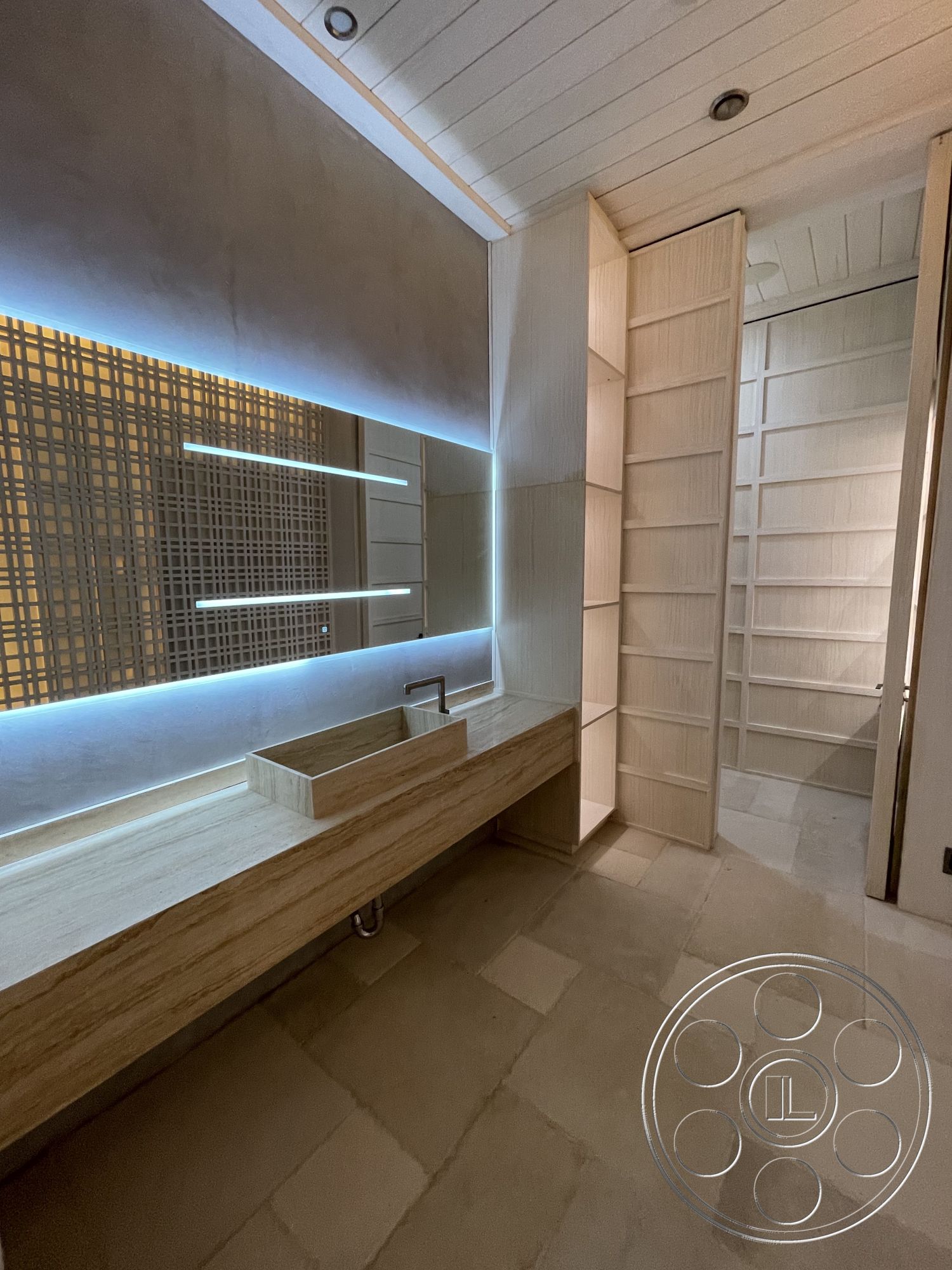 Modern 509 - interior neutral color palette, interior recessed lighting, interior textured plaster wall, interior minimalist design, interior linear LED lighting, interior marble bathroom vanity, interior limestone flooring, interior light wood cabinetry, interior wooden shelving system, interior frosted glass partition, interior modern sink fixture, interior open shelving, interior contemporary aesthetic, interior clean lines and geometric forms
