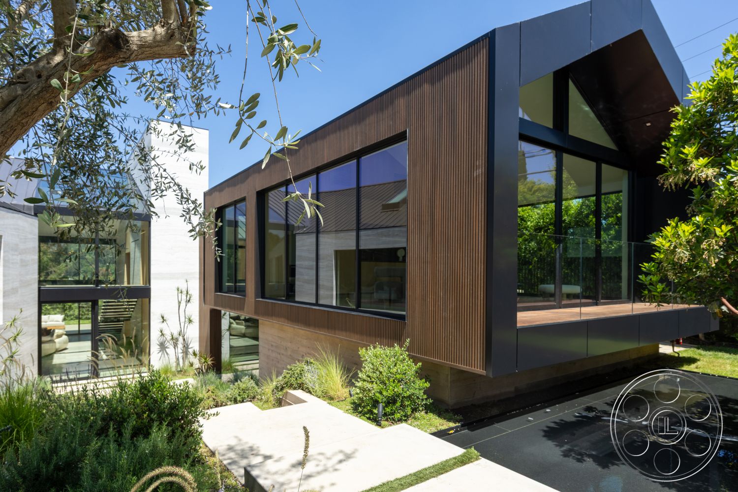 Modern 510 - large glass sliding doors, open floor plan, surrounding greenery, horizontal wood paneling, flat roof design, landscaped garden setting, exterior concrete walls, minimalist architectural details, modern outdoor living area, exterior glass window panels, exterior wood slat siding, exterior black metal accents, rectangular patio deck, contemporary style architecture, polished stone patio flooring, built-in planters