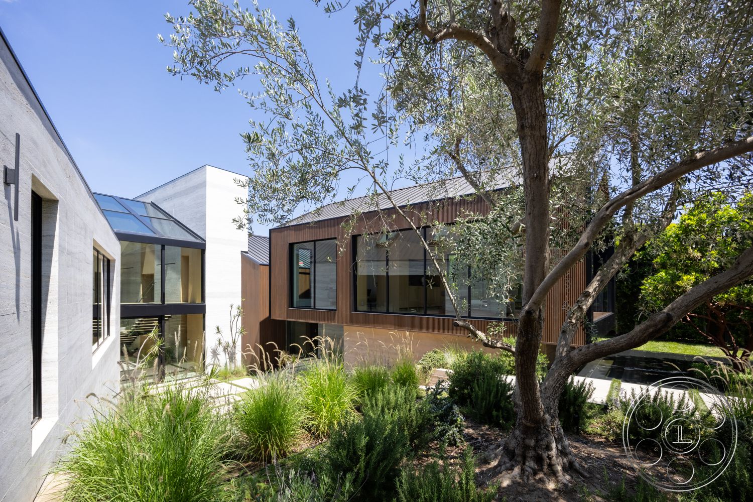 Modern 510 - exterior, landscaped garden, flat roof, greenery accents, concrete walls, glass windows, natural stone pathways, seamless indoor-outdoor flow, wood siding, olive trees, metal roof, urban residential setting, rectangular layout, exposed structural elements, contemporary architectural style, floor-to-ceiling glass panels, modern outdoor design, multi-faceted shapes, small water feature, native plant landscaping