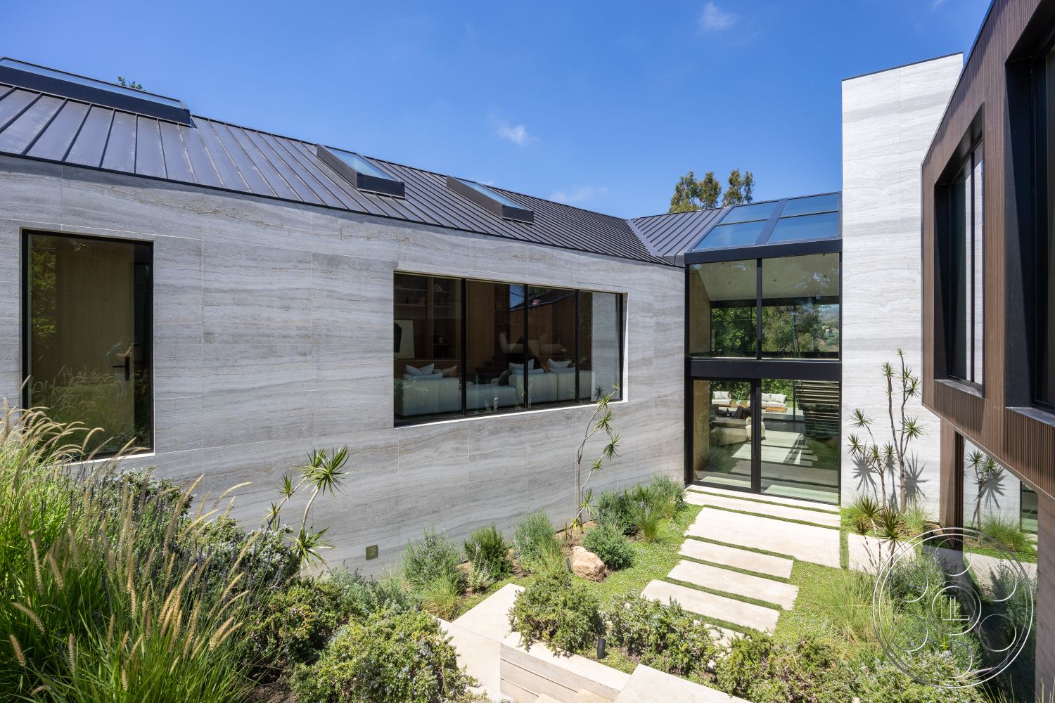 Modern 510 - natural stone elements, modern architectural style, landscaped garden area, floor-to-ceiling glass windows, contemporary residential design, exterior glass window panels, exterior limestone facade, flat metal roofing, exterior steel door, rectangular stone pathway, sloped garden setting, minimalistic exterior detailing, exposed concrete framing, greenery accent landscaping, panelled wood cladding, modern courtyard layout