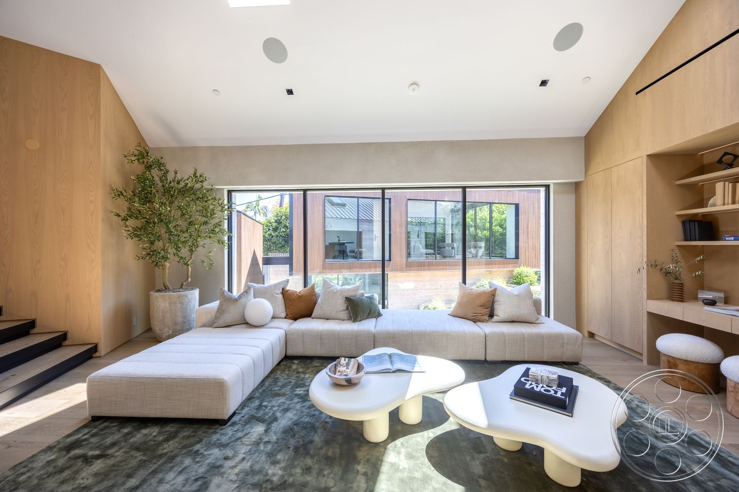 Modern 510 - textured area rug, floor-to-ceiling windows, decorative indoor plant, minimalist coffee table, neutral color scheme, hardwood flooring living room, custom built-in shelving, natural light filled space, contemporary design details, exposed wood paneling interior, contemporary modular sofa
