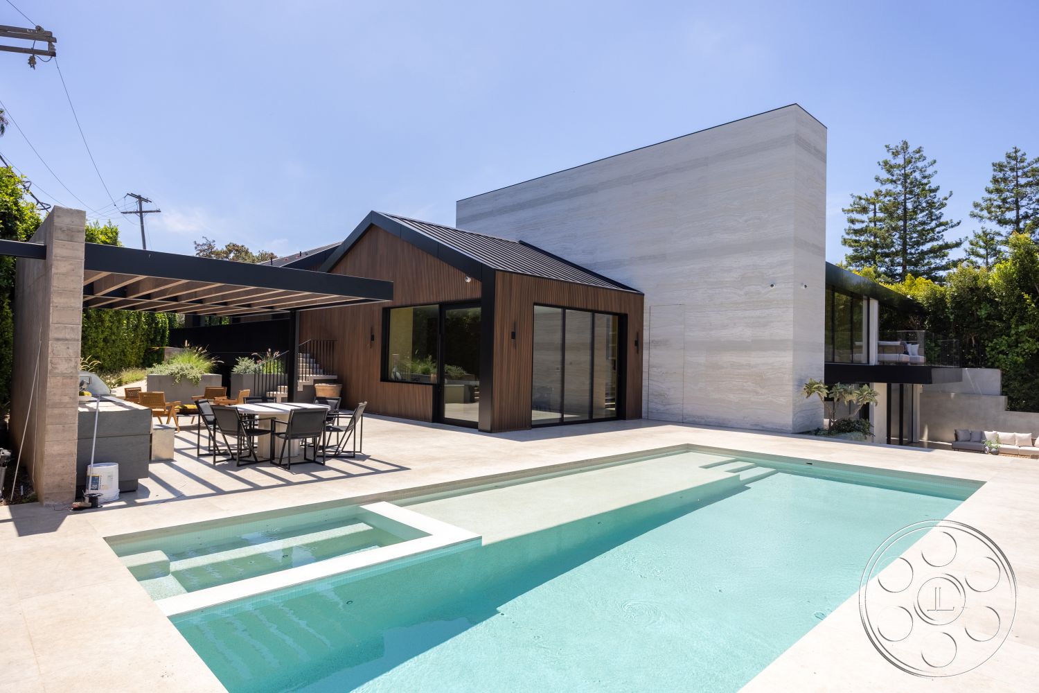 Modern 510 - minimalist design elements, glass sliding doors, large windows for natural light, surrounding greenery, rectangular swimming pool, urban residential setting, dark wood siding, contemporary architectural style, landscaped garden area, exterior concrete patio floor, wood pergola structure, textured stone feature wall, concrete pool border, stainless steel outdoor furniture, metal railing details, open-plan living area, modern flat roof, zen-inspired outdoor space, sunlit outdoor dining area, floating steps to garden