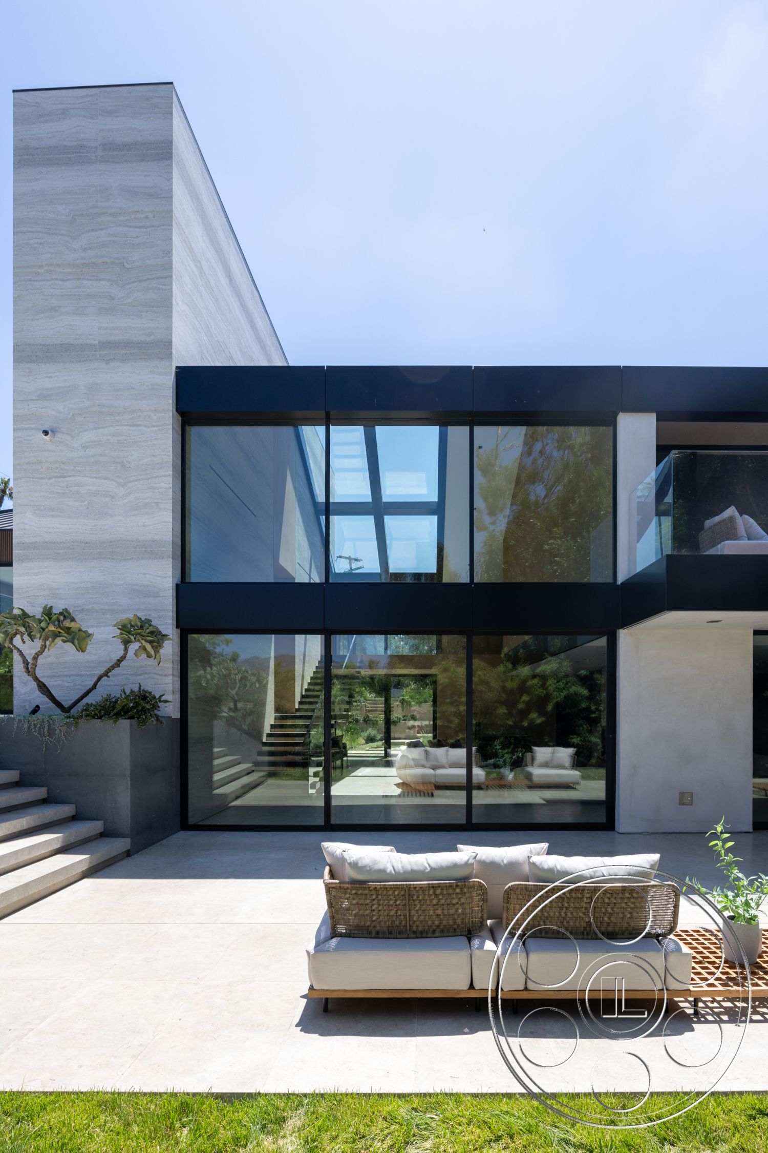Modern 510 - sliding glass door, lush green lawn, contemporary architecture, landscaped garden area, natural light emphasis, open concept living space, concrete patio floor, urban hillside setting, multilevel, minimalist outdoor seating, exterior glass wall facade, raised concrete steps, steel framed windows, boxy architectural form, modernist exterior design, smooth stone cladding, aluminum panel trim, transparent balcony railing, angular roofline