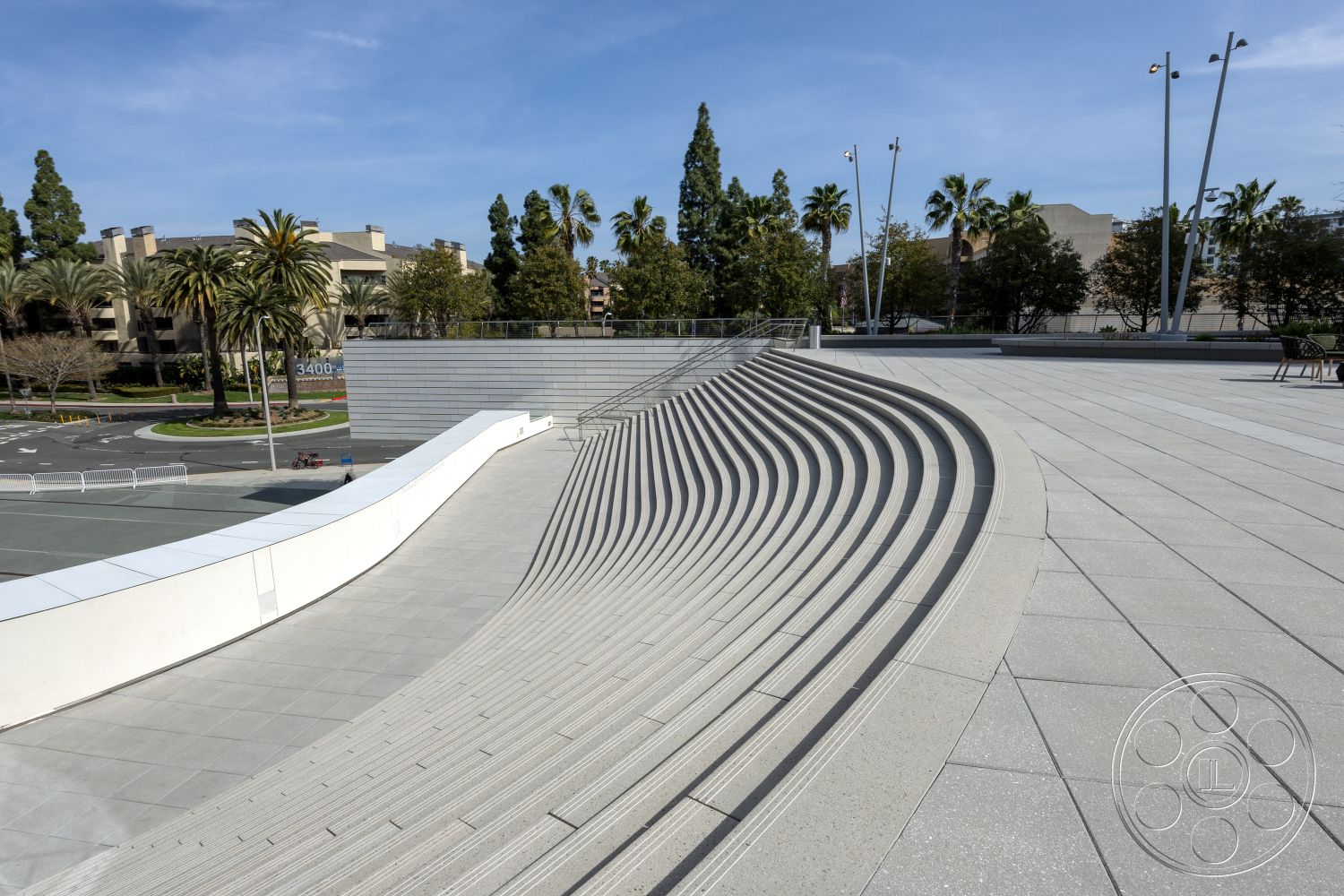 Museum 4 - concrete planters, curved pathways, modern minimalist architecture, contemporary architectural details, linear lighting fixtures, exterior concrete wave seating area, exterior concrete plaza flooring, landscape palm trees, curved concrete stair design, rectangular concrete benches, horizontal concrete accent walls, textured concrete surface finishes, outdoor urban space, surrounding palm tree landscape, seamless concrete transitions, open public space design