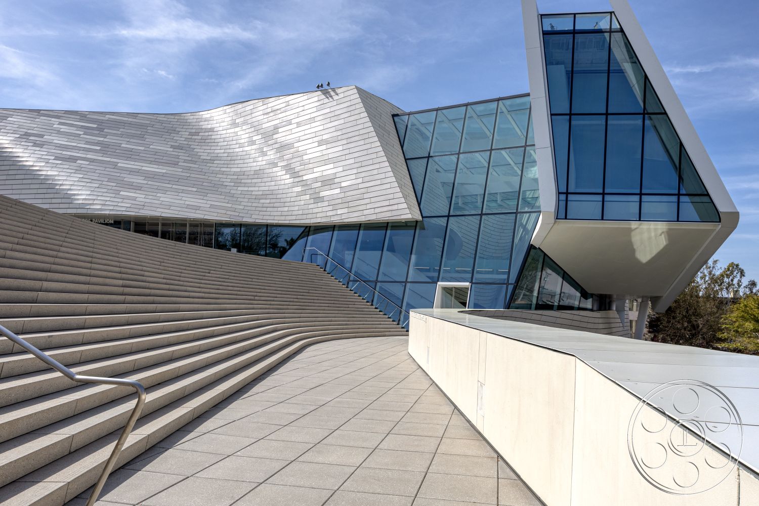 Museum 4 - exterior, polished concrete flooring, landscaped surroundings, metal railing, urban setting, textured wall panels, bright natural lighting, open-air pavilion, modern minimalist style, floor-to-ceiling glass windows, steel frame construction, glass curtain wall, contemporary architectural details, angular architectural forms, slate roof tiles, rectangular steps, curved staircase design, asymmetrical facade, plaza with stone seating