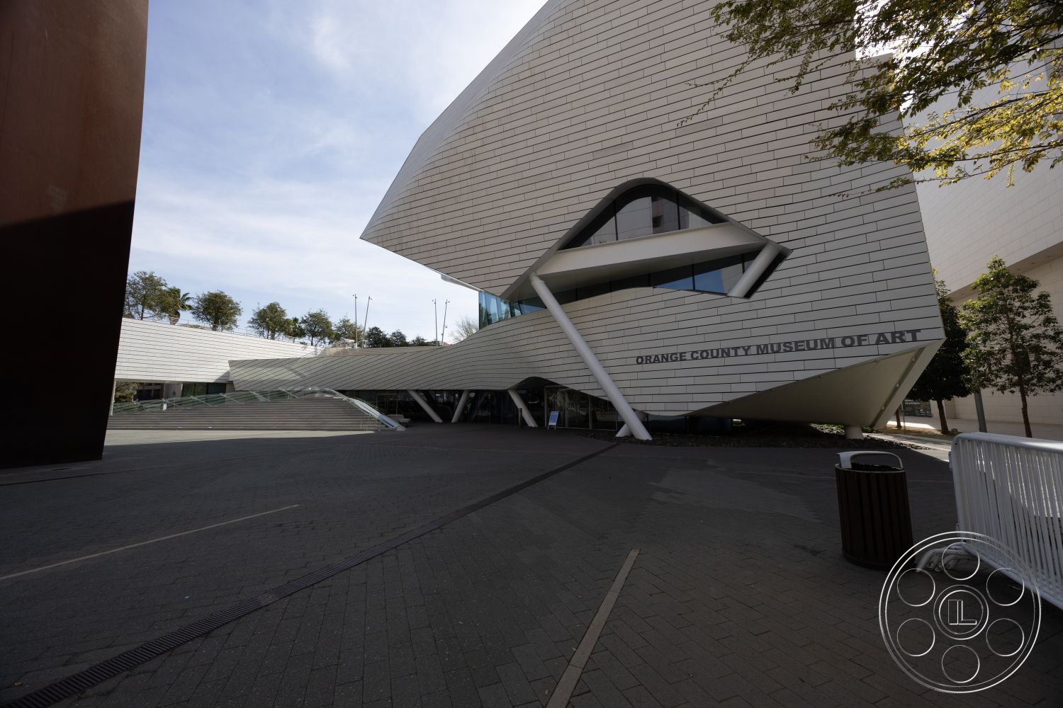 Museum 4 - exterior, modern architecture, minimalist aesthetic, large glass windows, sustainable materials, stainless steel railings, asymmetrical design, angular forms, architectural lighting fixtures, public art installation, white aluminum cladding, zigzag roofline, cantilevered structure, concrete plaza flooring, landscaped green spaces, curved façade, urban museum setting