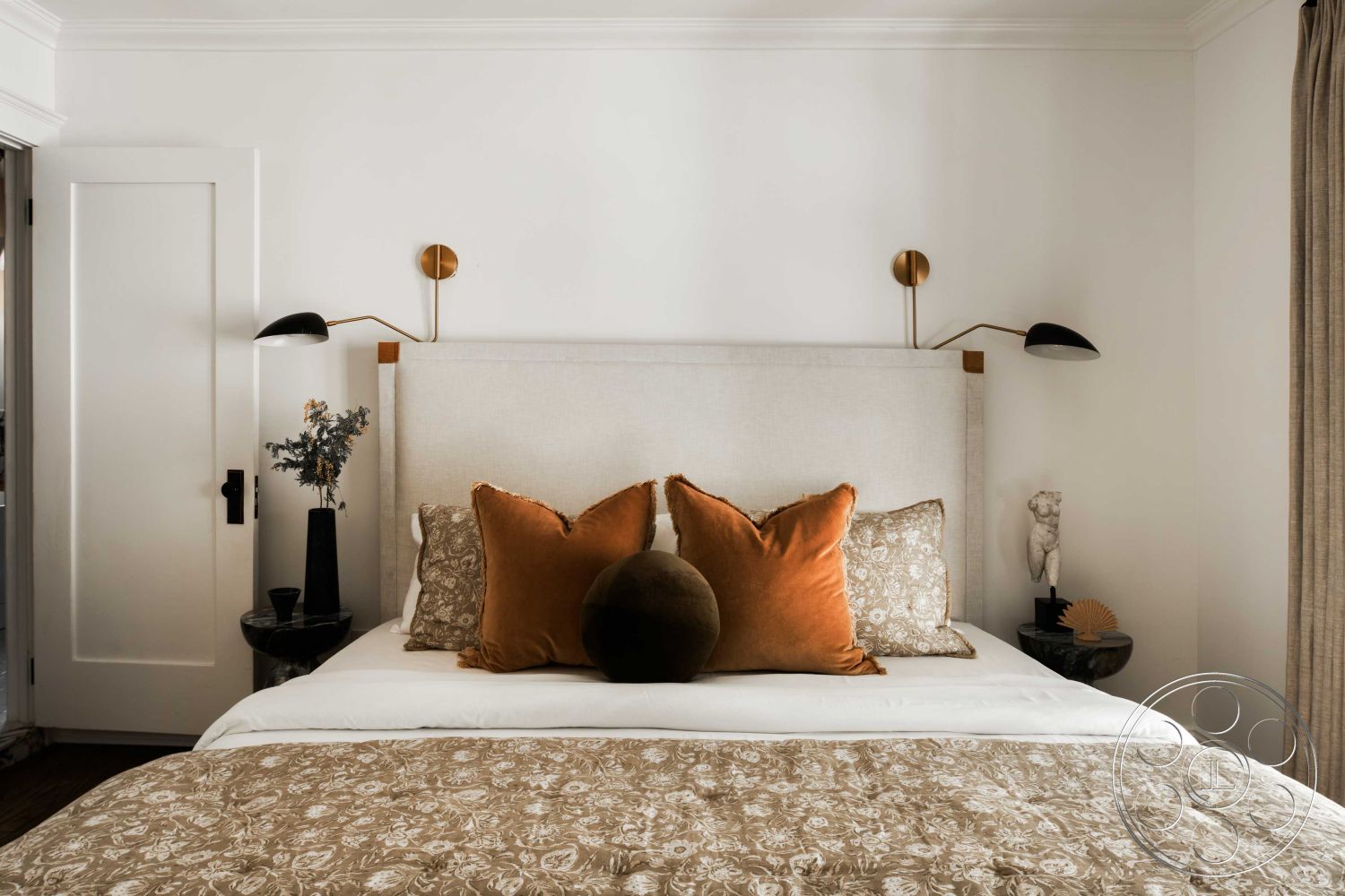 Spanish 166 - neutral color palette, decorative throw pillows, brass wall sconces, white painted walls, modern minimalist design, hardwood bedroom floors, ensuite, wooden bedside tables, interior bedroom, contemporary art decor, floor-to-ceiling window treatments, beige linen headboard, textured patterned bedding, decorative vase with dried flowers, wall-mounted reading light