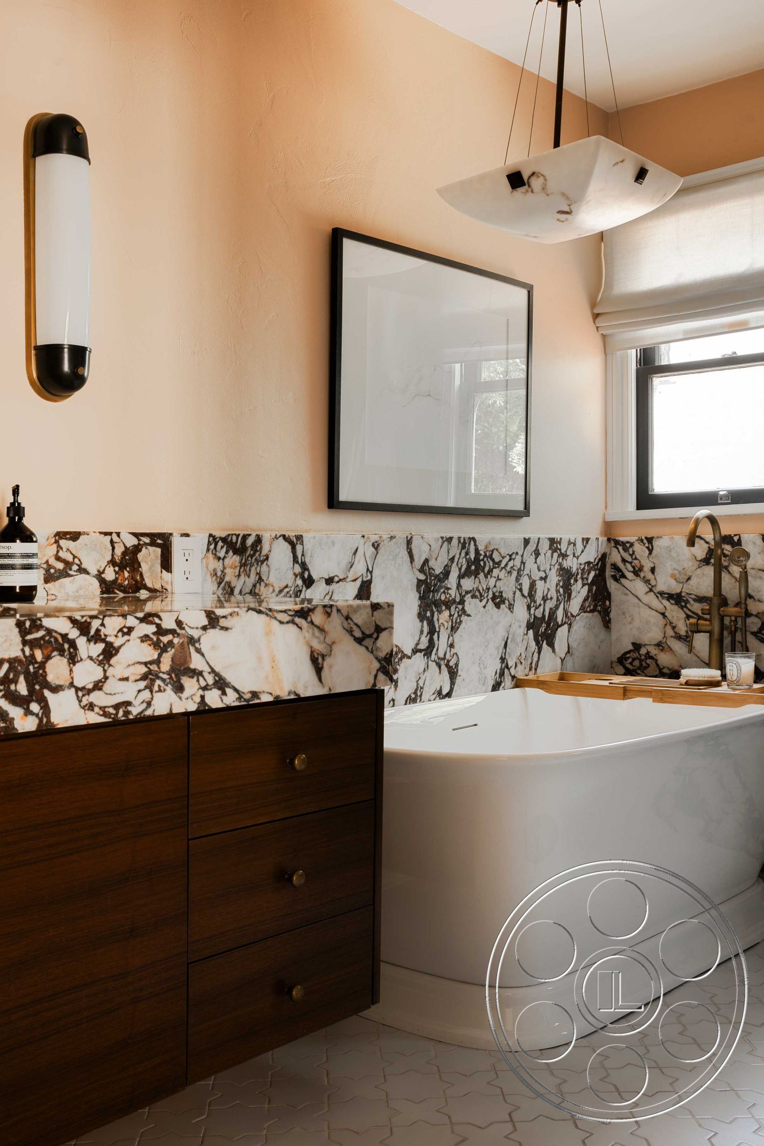 Spanish 166 - textured plaster walls, marble countertop, white freestanding bathtub, minimalist design elements, natural light from windows, modern pendant lighting, luxurious spa-like atmosphere, hexagonal tile flooring, contemporary bathroom style, marble bathroom wall, wood bathroom vanity, brass faucet fixtures, neutral color scheme interior, ensuite