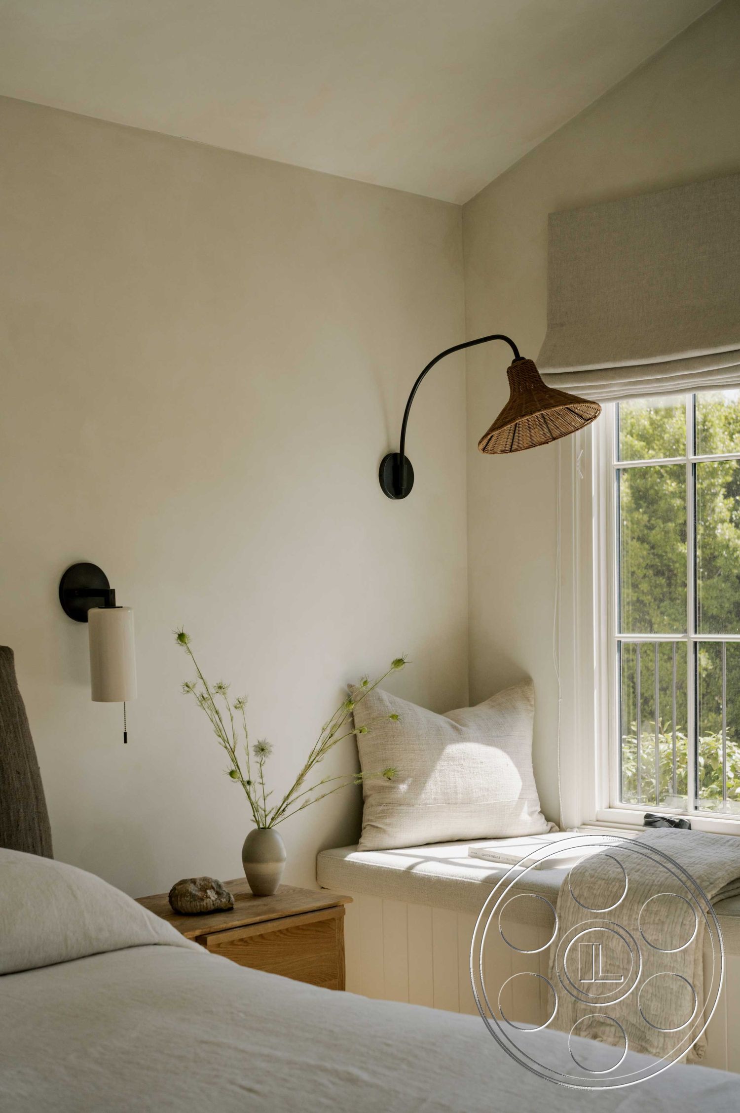 Americana 429 - interior cozy reading nook, interior woven pendant lighting, interior hardwood bedroom floors, interior textured plaster walls, interior soft color palette, interior wood accent furniture, interior built-in window seat, interior linen window treatments, interior natural fiber cushions, interior decorative vase with greenery