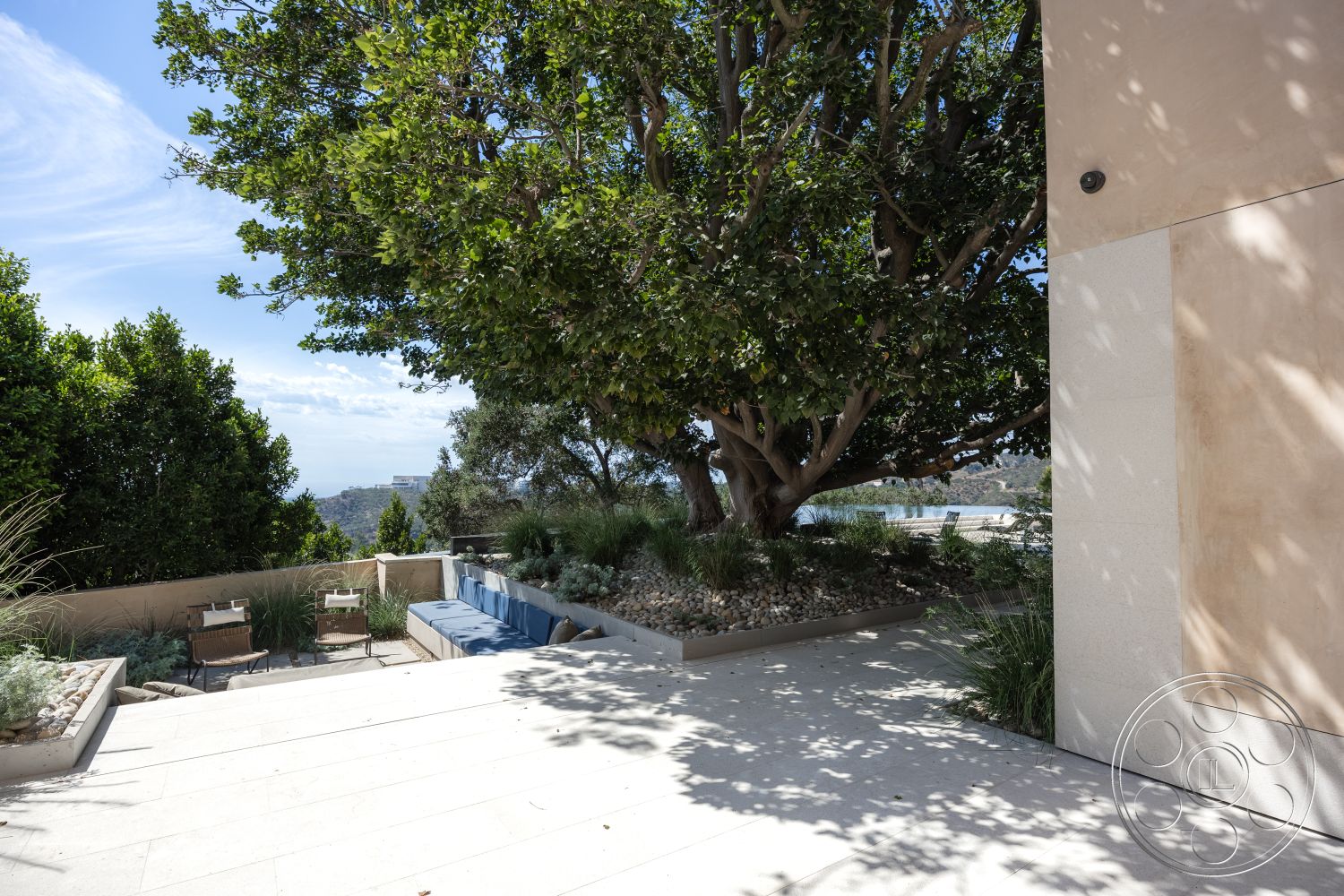 Modern 511 - exterior, city skyline view, ocean view, green grass lawn, contemporary architectural design, minimalist outdoor furniture, suburban backyard retreat, rectangular outdoor seating area, modern outdoor living space, textured stucco wall finish, smooth stone patio flooring, built-in garden bench, landscaped native planting beds, decorative gravel ground cover, large shade tree canopy, curved stone planter borders, framed outdoor terrace, natural stone veneer, flush concrete steps