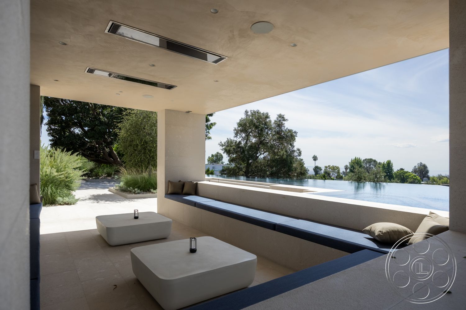Modern 511 - large glass windows, slate stone flooring, landscaped garden view, modern landscape design, concrete seating area, exterior patio, minimalist outdoor furniture, flush mount ceiling lights, rectangular infinity pool, stucco ceiling, horizontal wood bench, open-air relaxing space, built-in lighting fixtures, contemporary outdoor architecture, natural greenery surroundings, panoramic skyline view