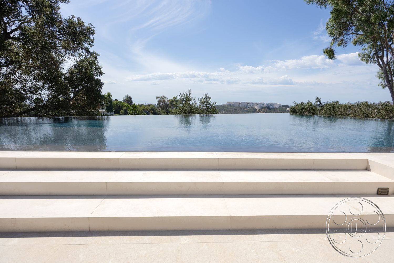 Modern 511 - modern architecture, minimalist design, outdoor living space, urban skyline view, landscaped environment, sunny outdoor setting, surrounding garden area, interior infinity pool, rectangular infinity pool, concrete pool steps, smooth concrete pool border, contemporary outdoor aesthetic