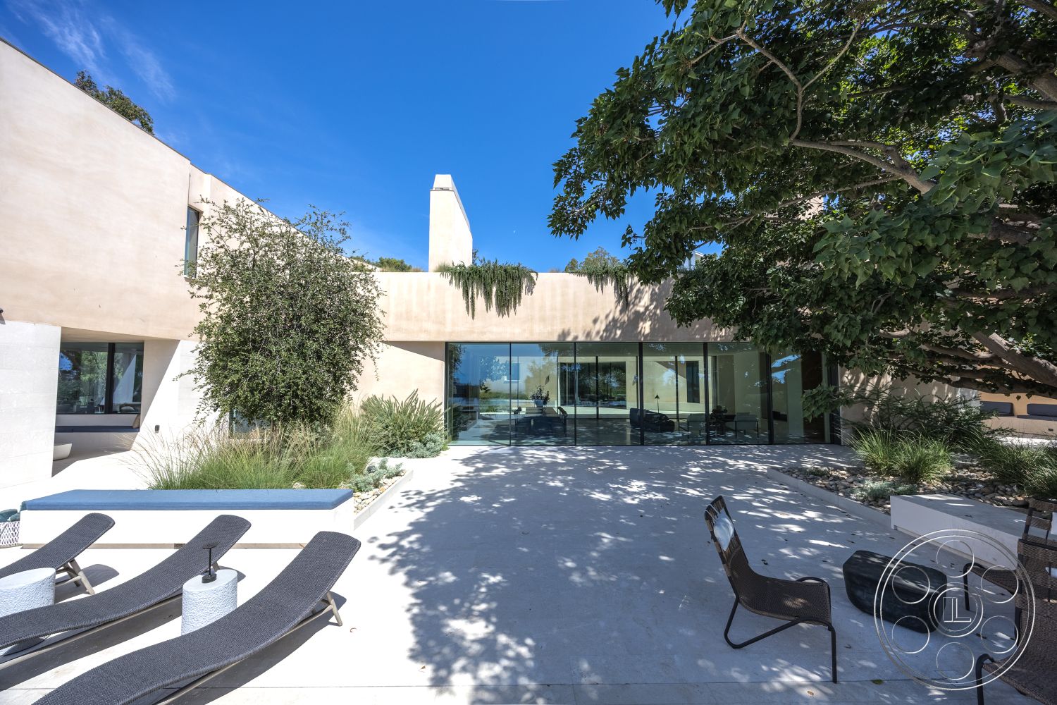 Modern 511 - glass sliding doors, open-concept layout, flat roof design, urban hillside location, exterior concrete patio floor, curved garden path, glass partition walls, minimalist architectural style, natural light-filled spaces, large overhanging eaves, integrated planters with greenery, rectangular pool border, exposed aggregate concrete steps, landscape with native plants, textured stucco exterior walls, modern outdoor lounge chairs, natural stone garden edging, vaulted outdoor ceiling, concrete bench seating, slate tile accents
