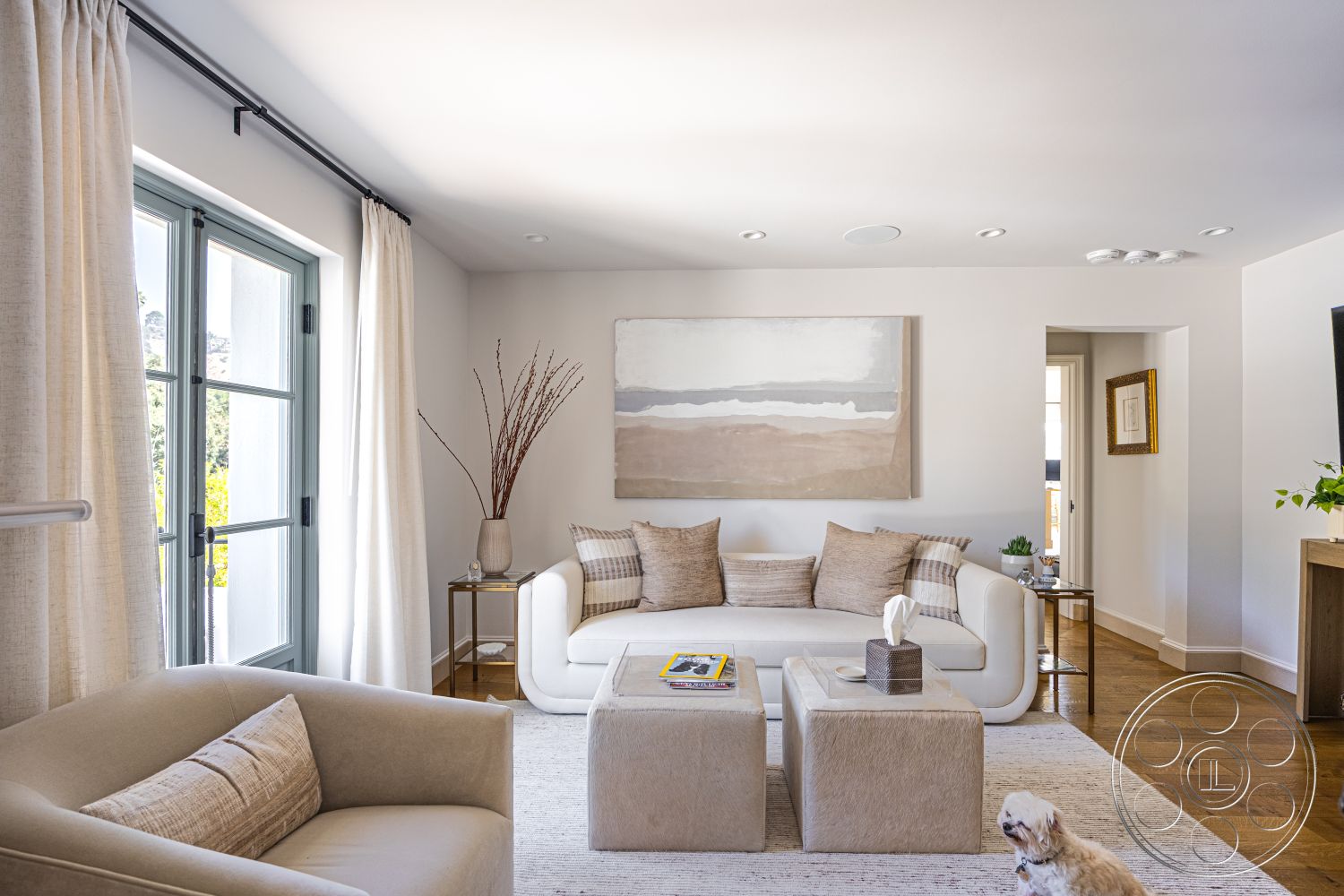 Spanish 168 - neutral color palette, stylish side table, floor-to-ceiling windows, open-concept living space, cozy ambiance, textured plaster walls, minimalist coffee table, comfortable seating arrangement, hardwood living room floors, natural light interior, contemporary furniture design, decorative plant accents, decorative throw blanket, framed artwork on wall, soft beige curtains, modern accent pillows, seating area with sectional sofa, elegant interior details, casual living area, stylish home atmosphere, urban mountain view setting