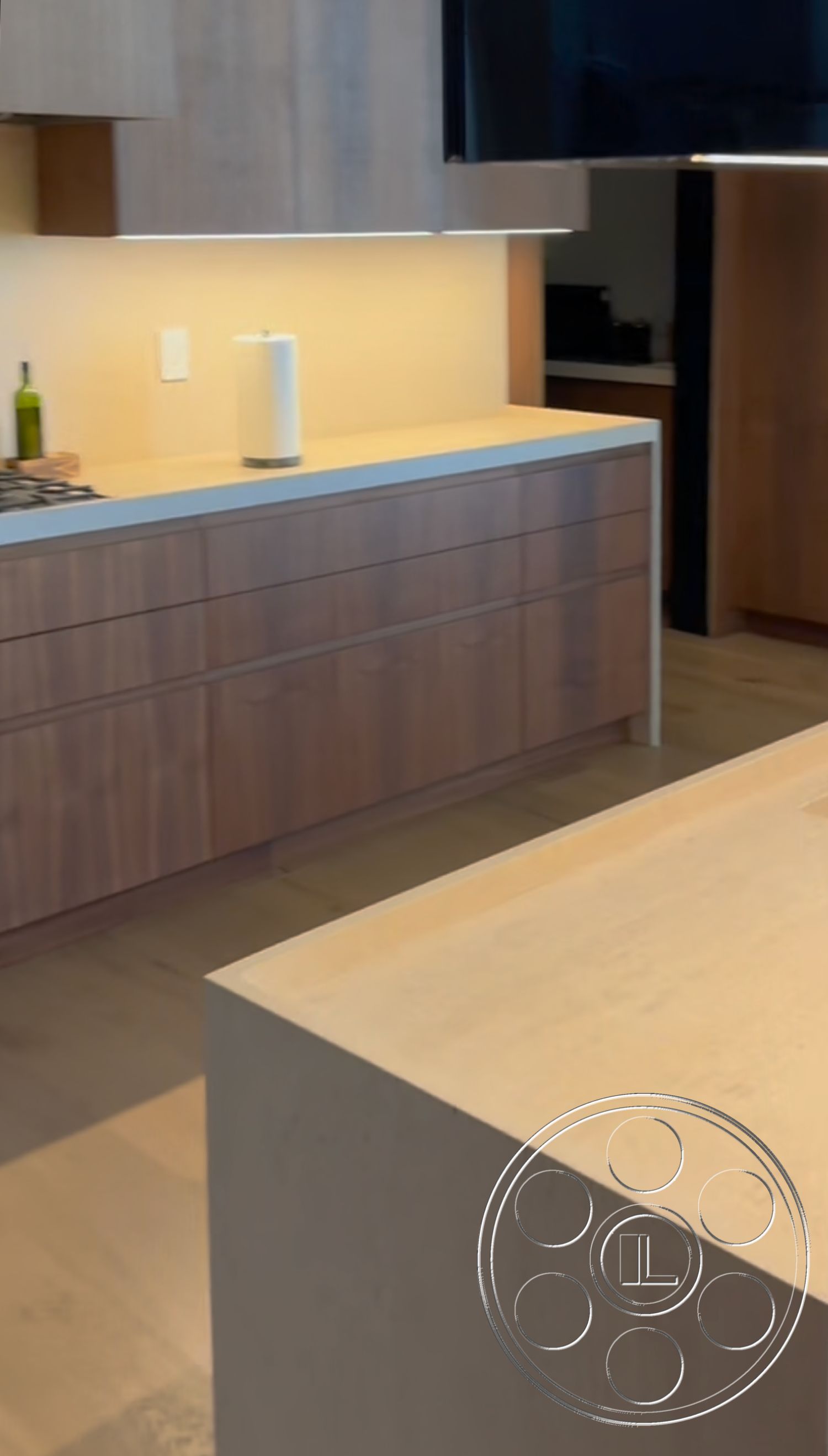 Modern 481 - kitchen, light hardwood flooring, subtle color palette, integrated kitchen appliances, contemporary kitchen design, open-concept kitchen layout, functional kitchen workspace, white quartz kitchen countertops, smooth surface finishes, interior kitchen with wood cabinetry, maple wood kitchen drawers, minimalist kitchen island, exposed wood grains in cabinetry, soft ambient kitchen lighting, modern cabinetry design, simple geometric shapes in kitchen architecture