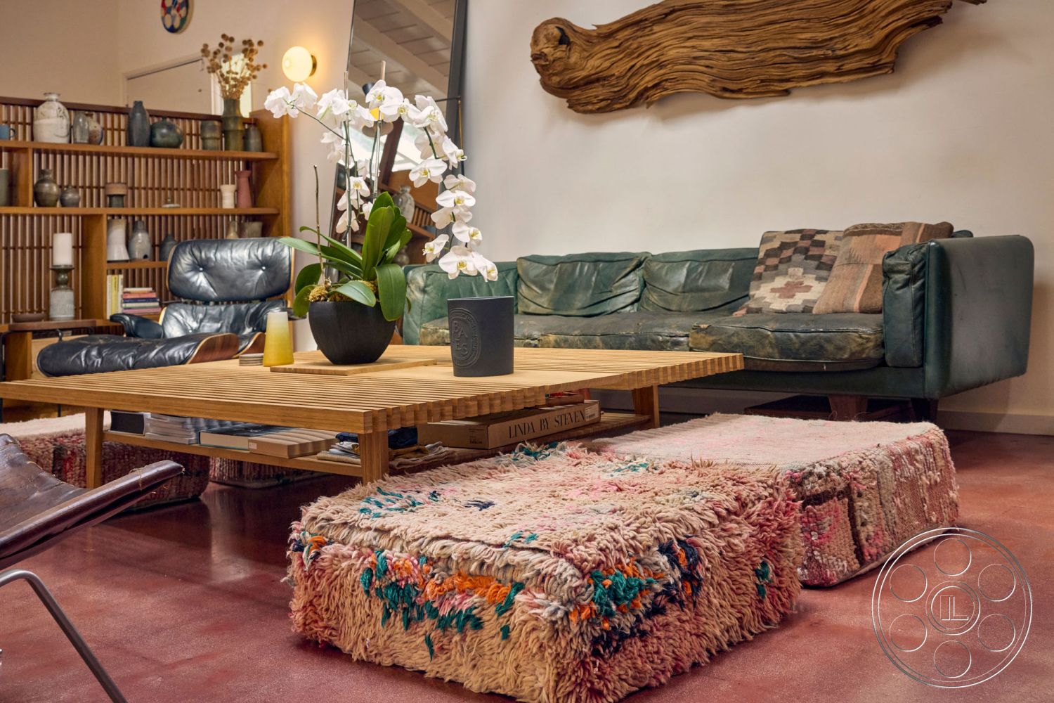 MCM 26 - interior hardwood laminate flooring, interior patterned throw pillows, interior bamboo coffee table, interior leather armchairs, interior shaggy area rugs, interior wood accent wall art, interior minimalist shelving units, interior potted orchid plants, interior ambient wall sconces, interior low-profile sectional sofa