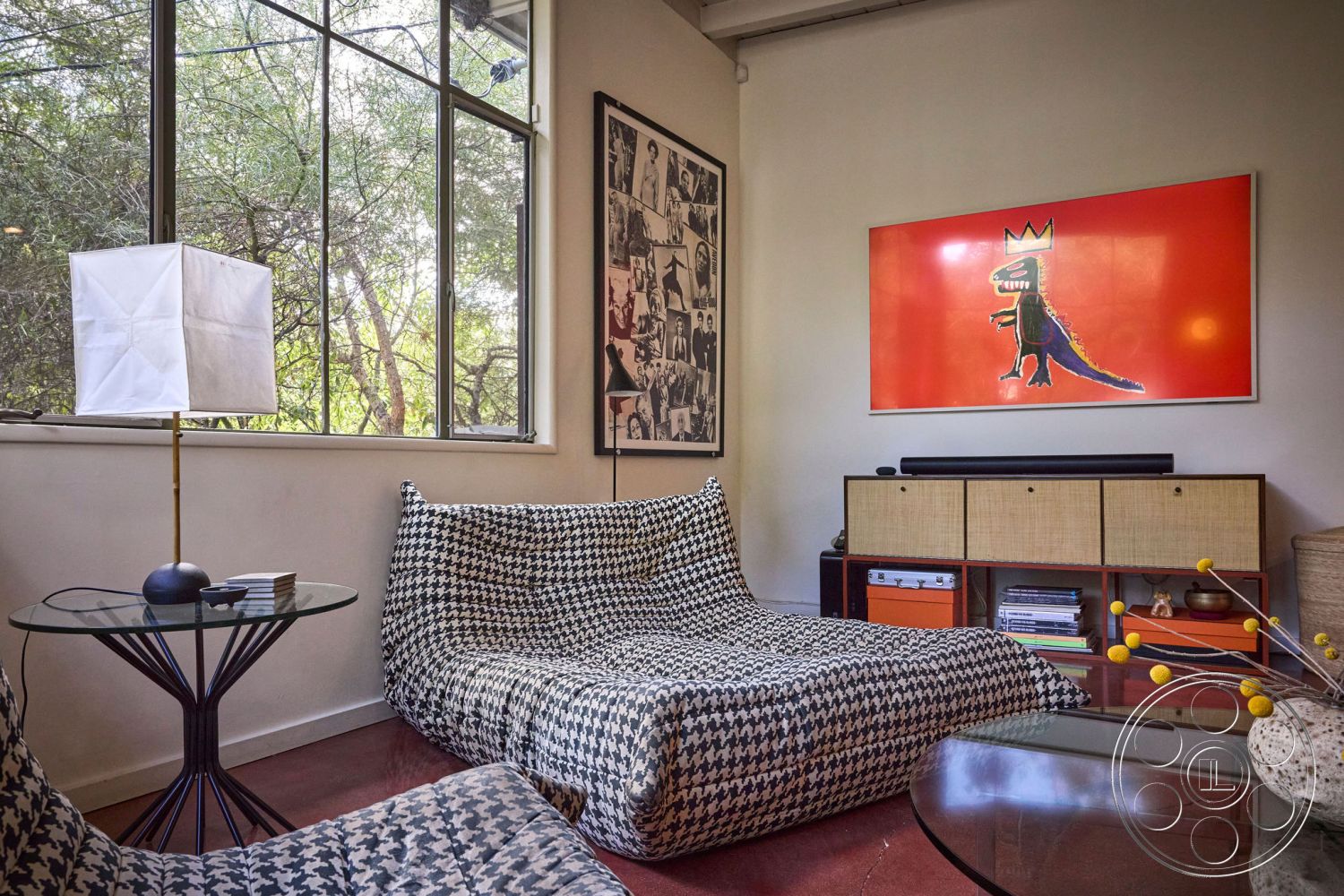 MCM 26 - neutral color palette, open floor plan, artistic wall decor, glass coffee table, floor-to-ceiling windows, textured wall finishes, bright color accent wall, minimalist furniture design, natural light ambiance, concrete slab flooring, interior modern living room, houndstooth patterned upholstery, vintage photo gallery wall, pendant lamp lighting, contemporary storage unit, functional seating area, rustic charm decor elements