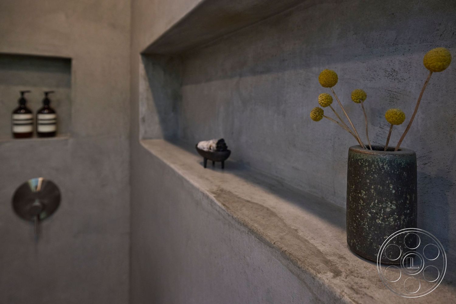 MCM 26 - neutral color palette, spa-like atmosphere, exposed concrete walls, modern decor accents, soft natural lighting, eco-friendly materials, functional design elements, contemporary interior, simple geometric forms, industrial style details, integrated shelving units, textured concrete surfaces, concrete shelf ledges, minimalist bathroom setting, clean lines interior