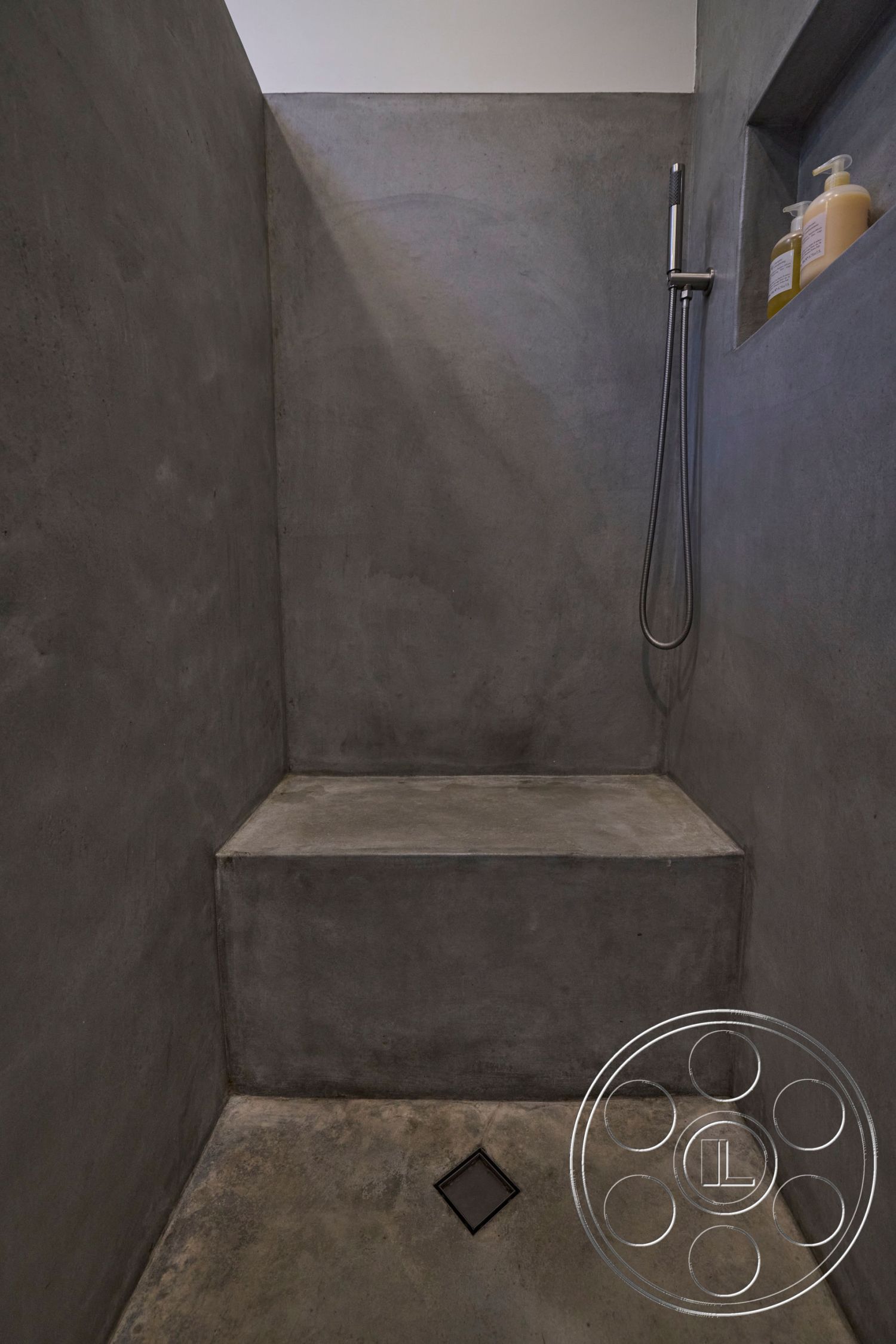 MCM 26 - interior concrete shower walls, interior concrete shower floor, interior bespoke concrete shower bench, interior exposed concrete finish, interior integrated shower niche, interior minimalist shower design, interior modern plumbing fixtures, interior linear floor drain