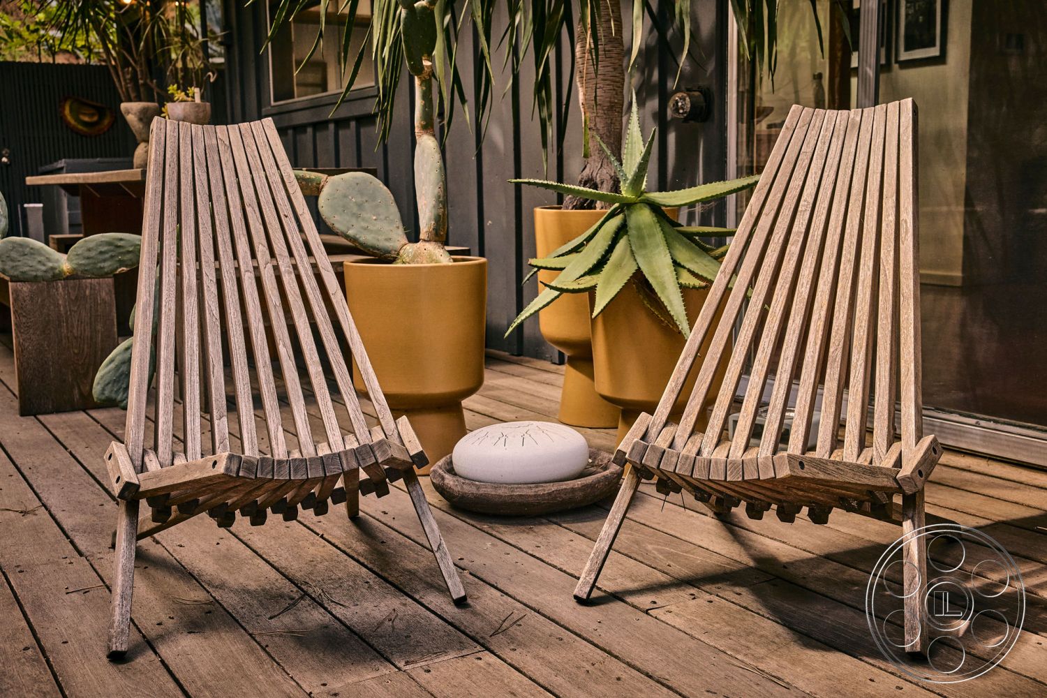 MCM 26 - contemporary outdoor space, modern minimalist design, exterior wood deck flooring, outdoor patio setting, slatted wooden lounge chairs, large potted cactus plants, yellow ceramic planters, natural wood grain finish, sunny garden environment, organic shapes and forms