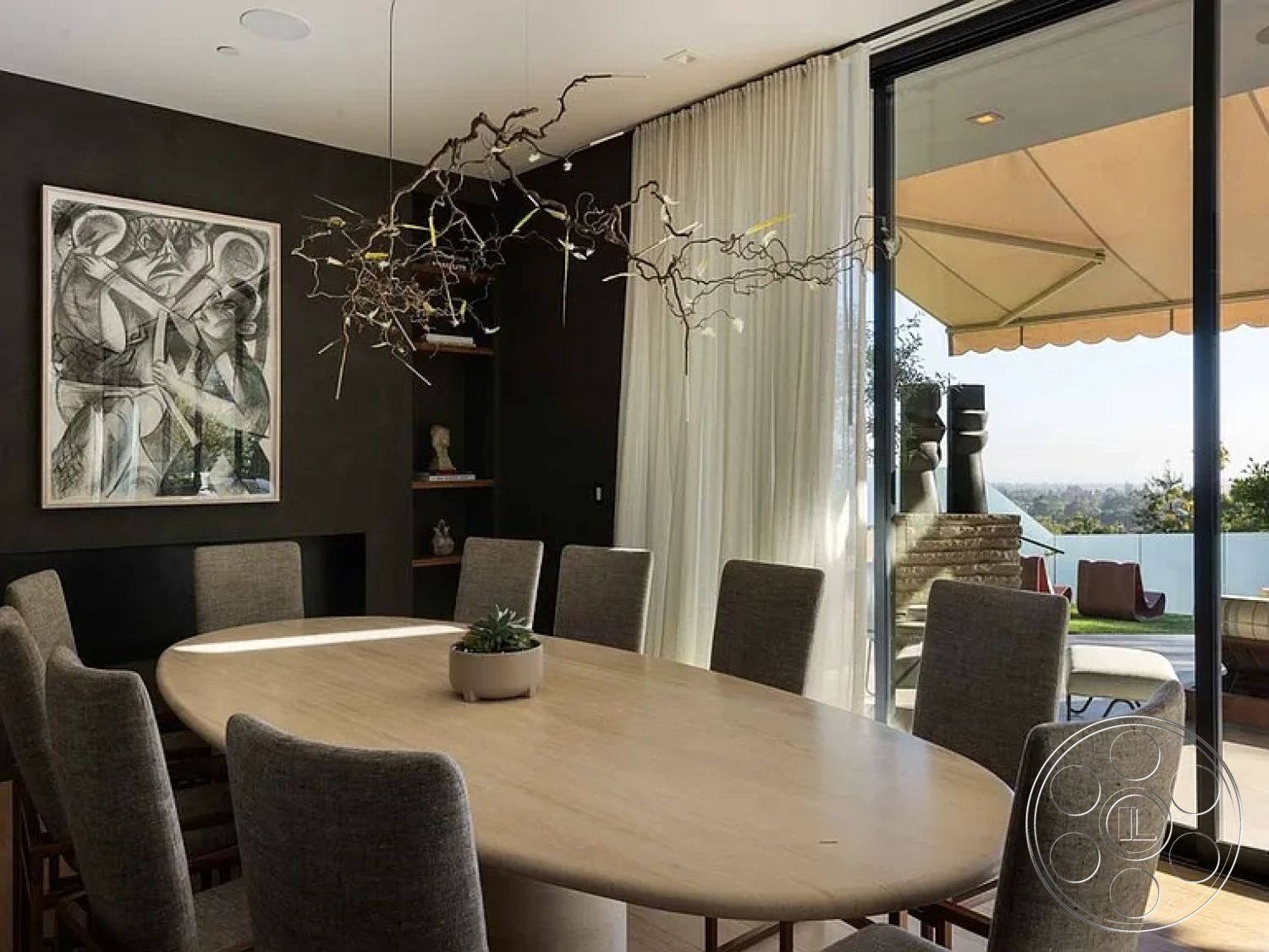 Modern 512 - neutral color palette, upholstered dining chairs, sheer white curtains, indoor-outdoor transition, natural light-filled space, interior dining room, minimalist decor style, floor-to-ceiling glass doors, landscaped outdoor area, oval wood dining table, dark gray accent wall, modern chandelier with branch design, wooden sideboard with shelving, contemporary artwork on the wall, views of the skyline